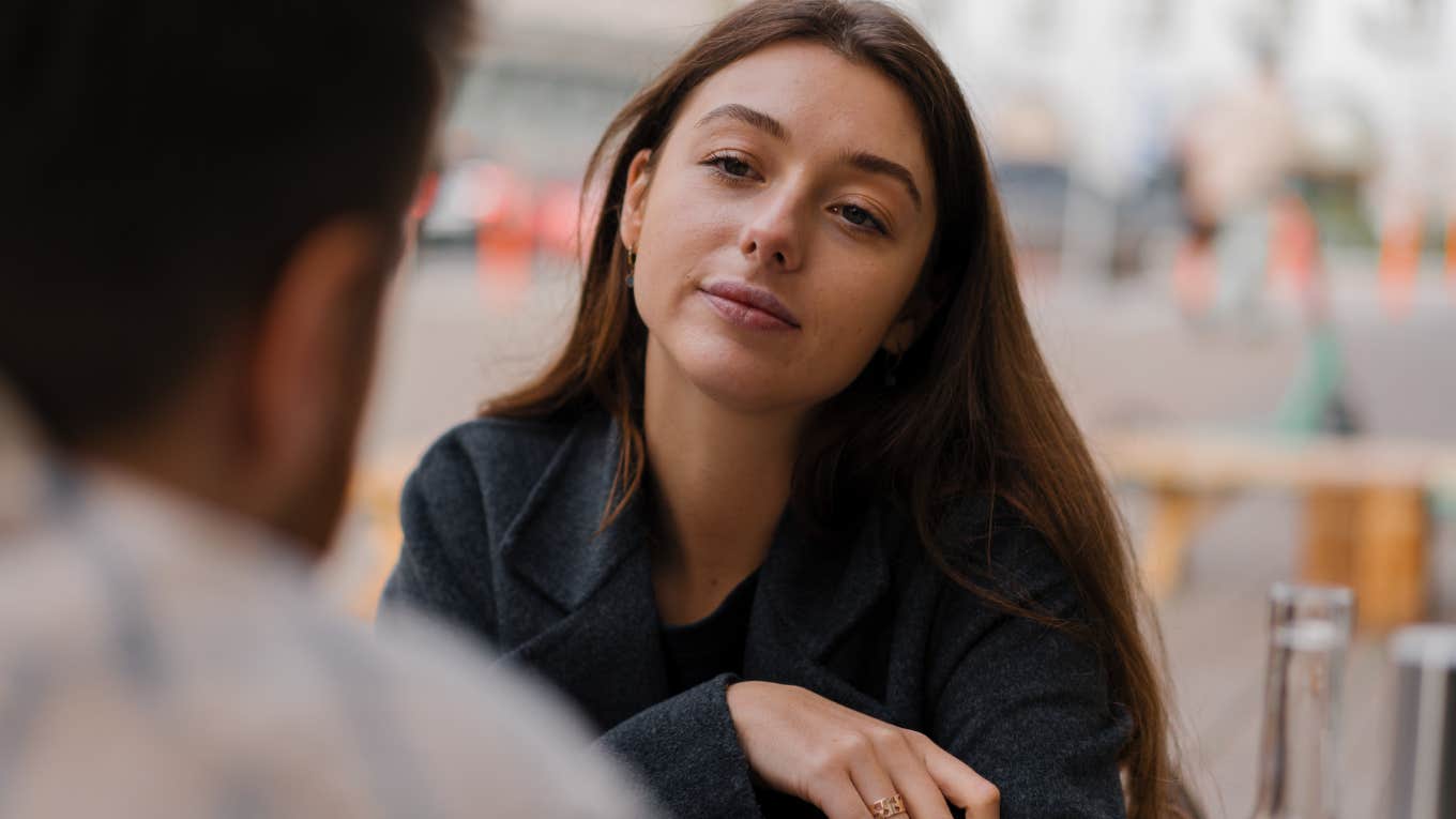 Millennial woman looking annoyed at her husband.