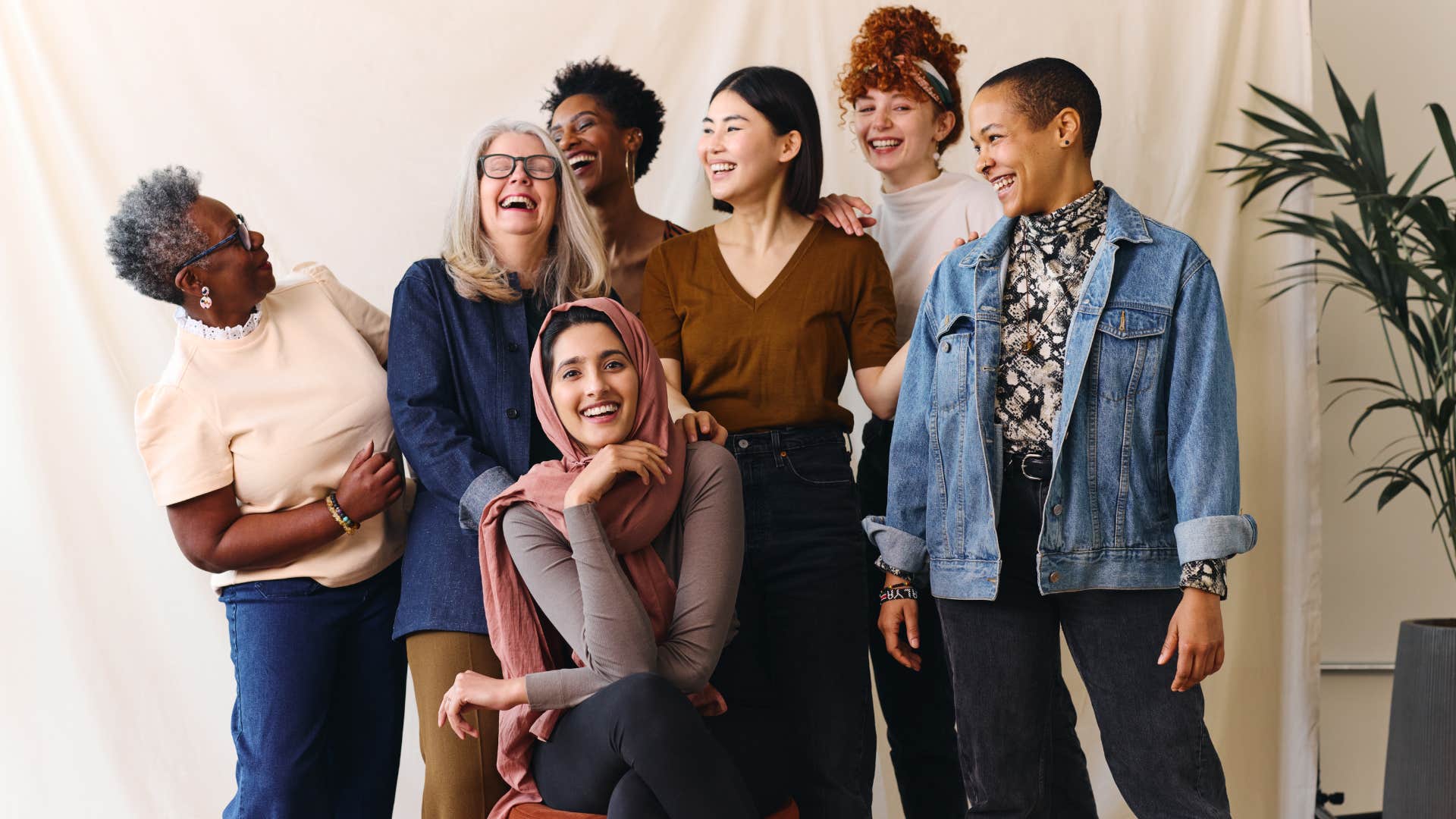 A group of diverse individuals pose for a photograph