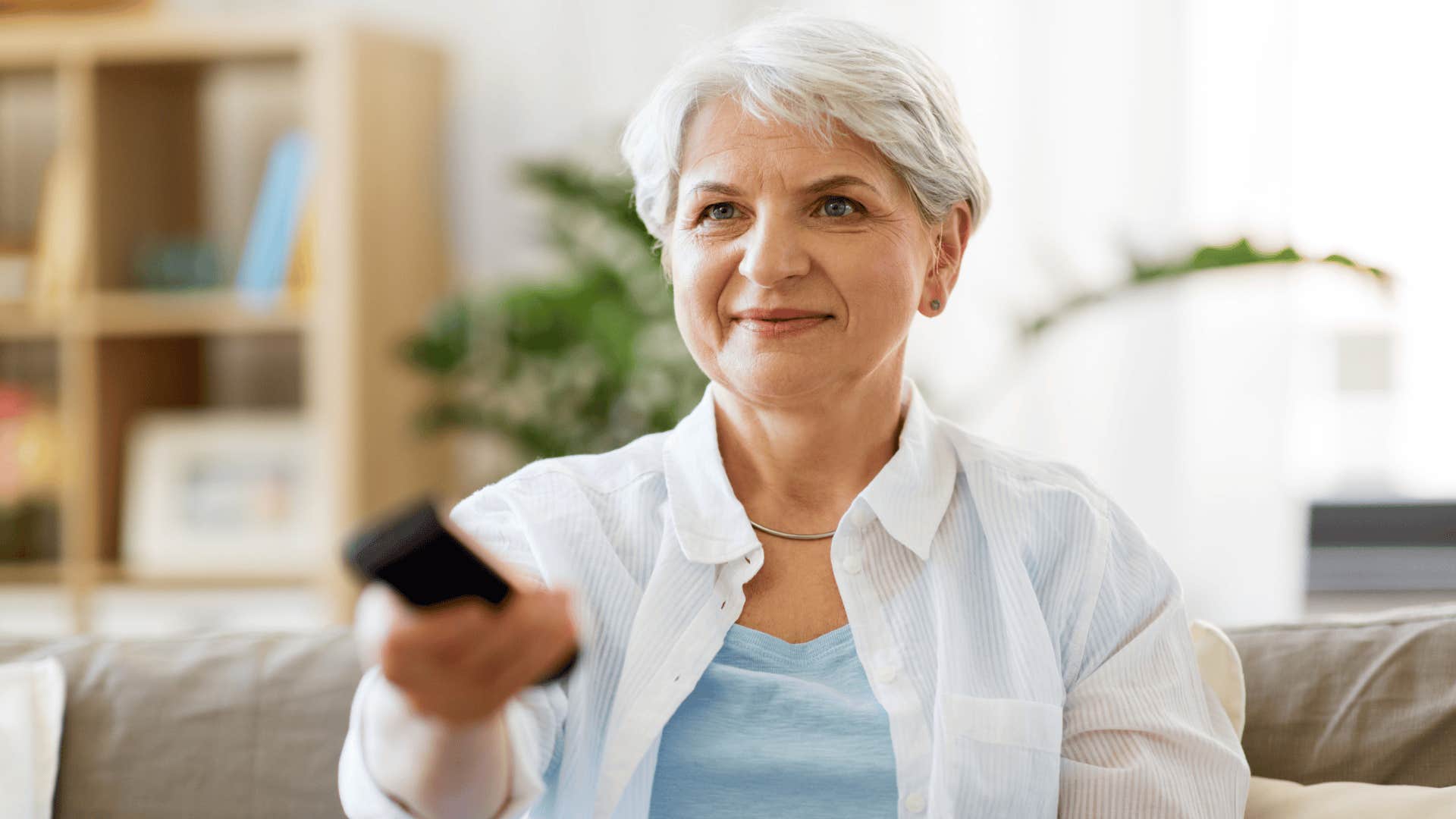 boomer woman watching cable tv