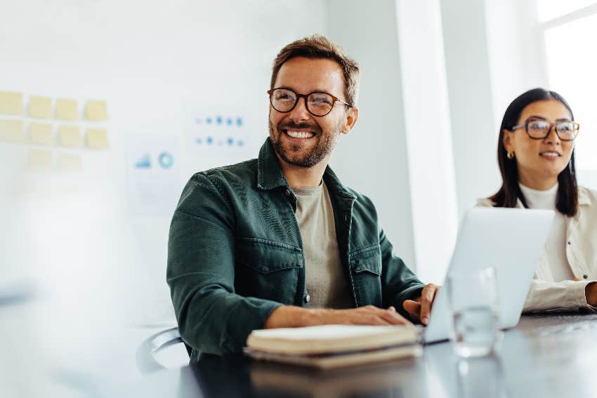 man smiling at table