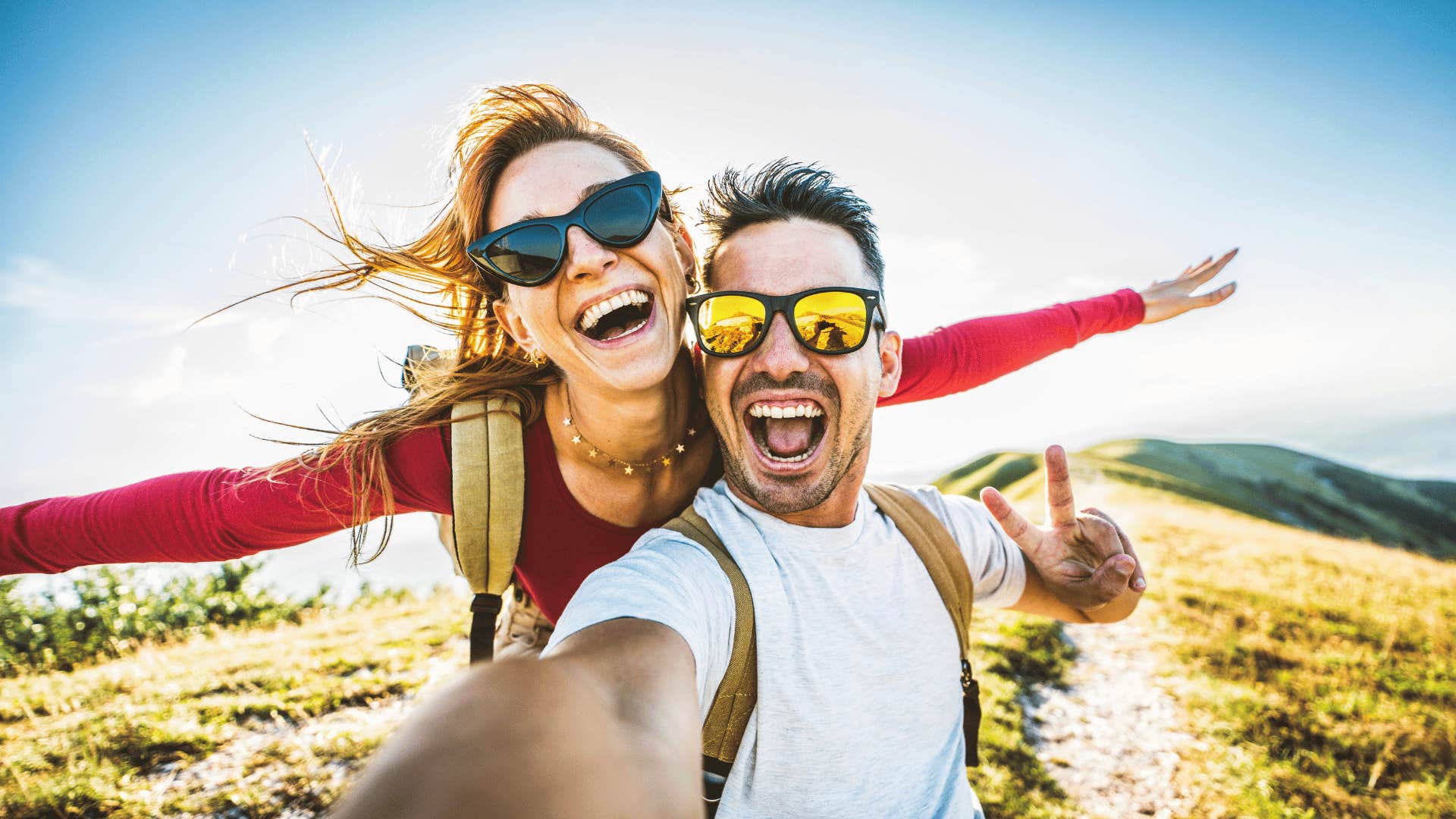 couple laughing and taking picture