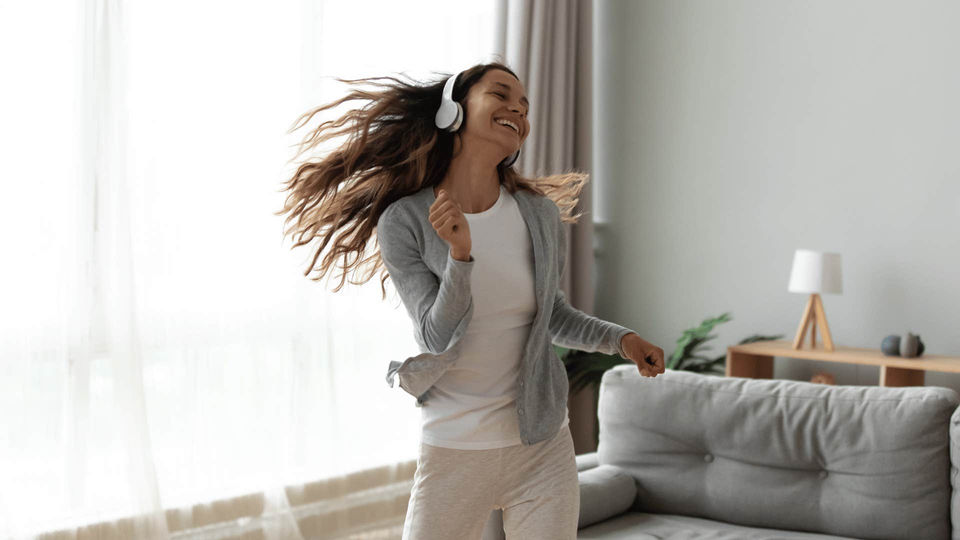 woman listening to music and dancing