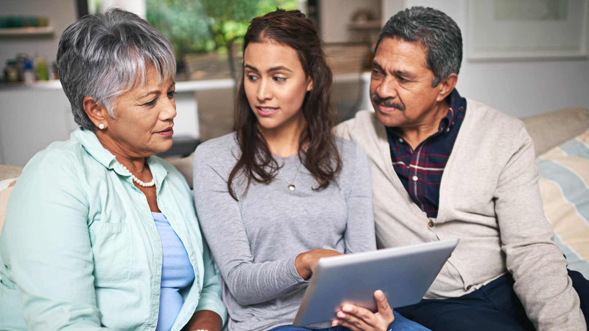 Gen Z woman relying on her parents for help understanding paperwork