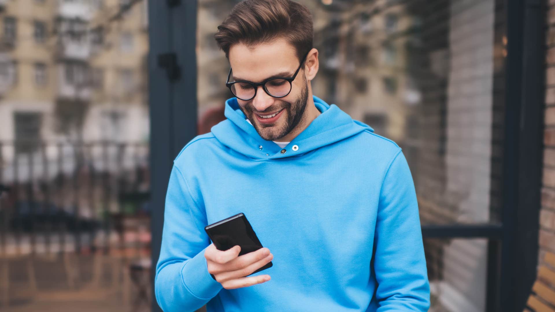 man looking at his bank statements on his phone