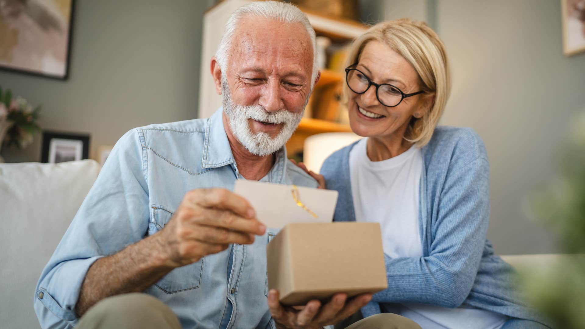 older couple reading a greeting card together