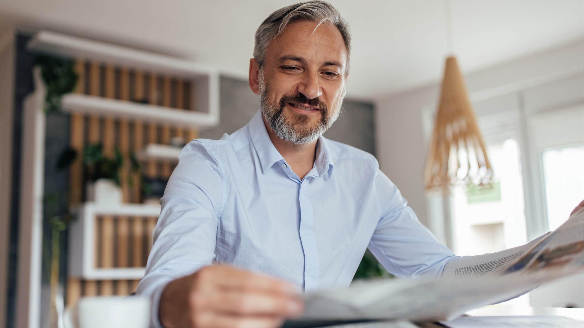 older man reading the newspaper