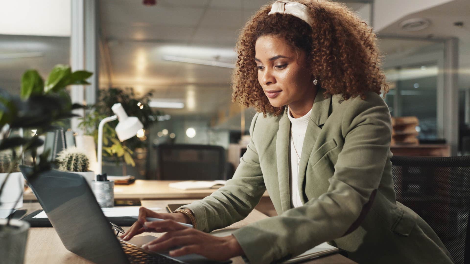 young professional woman working on her laptop