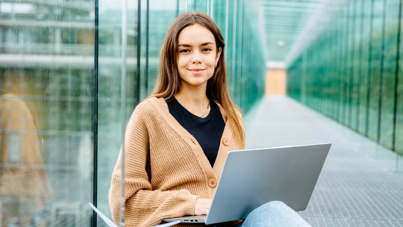 smiling gen Z worker in hallway