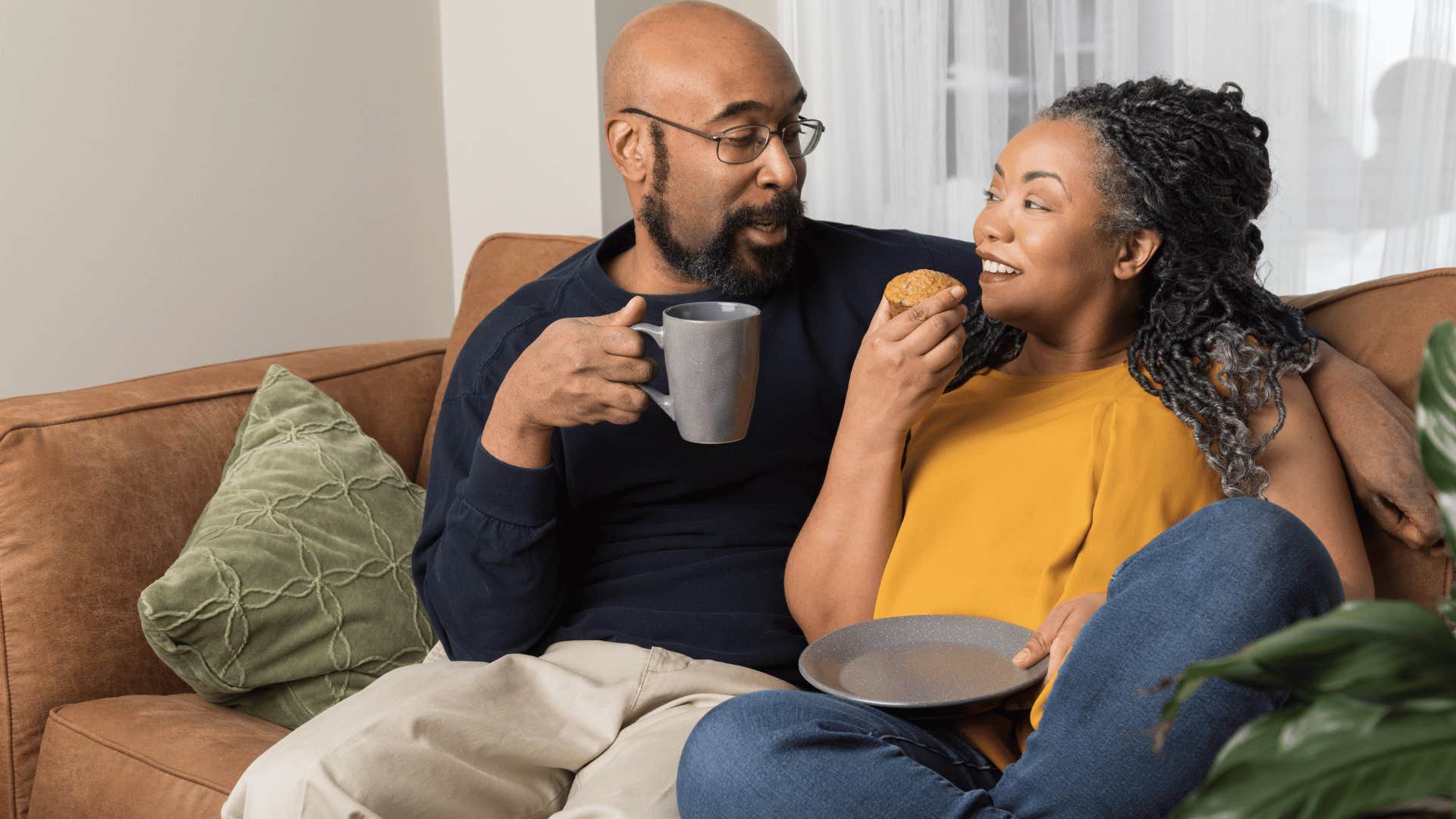 couple cuddling on couch