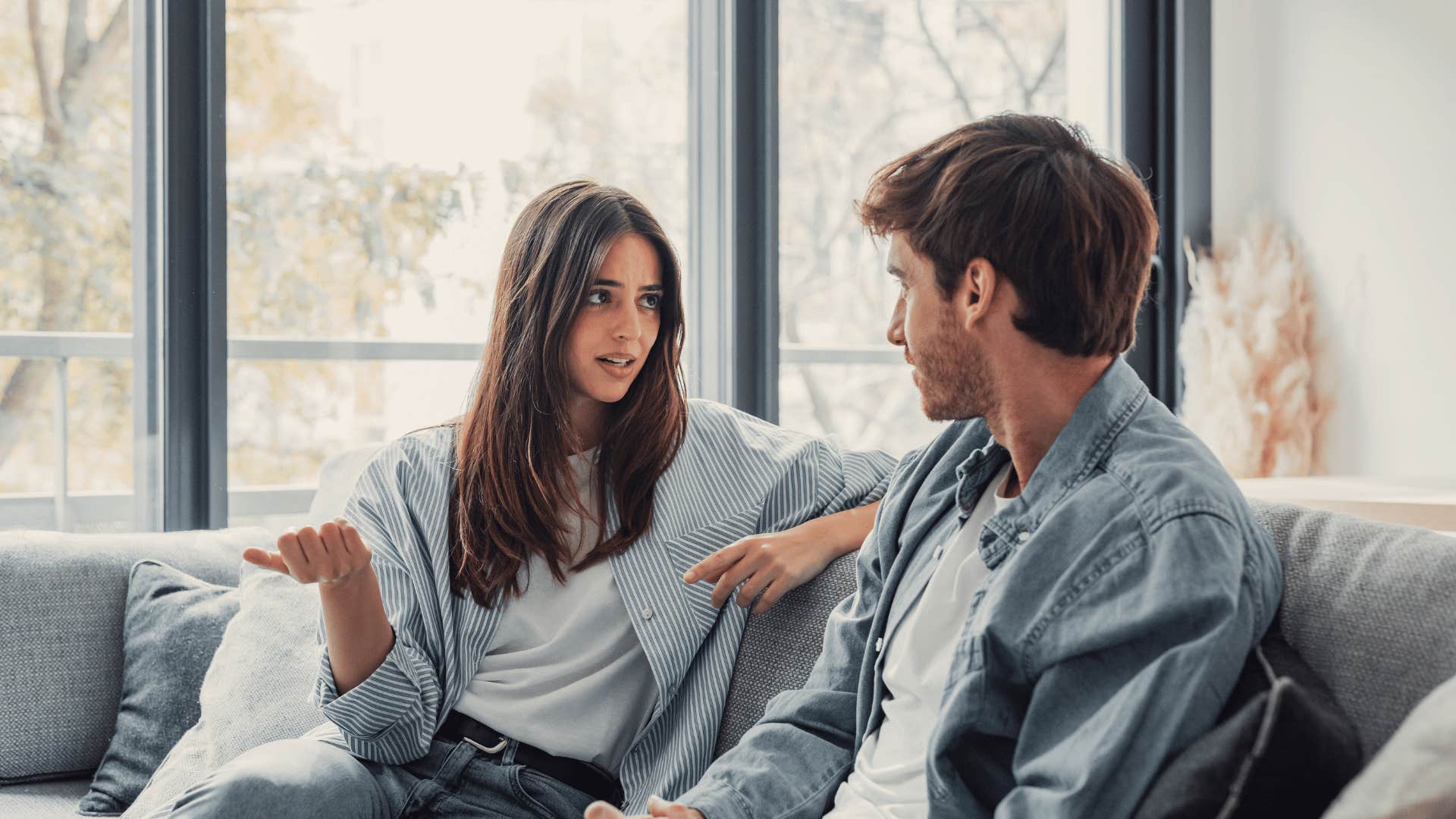 couple talking on couch