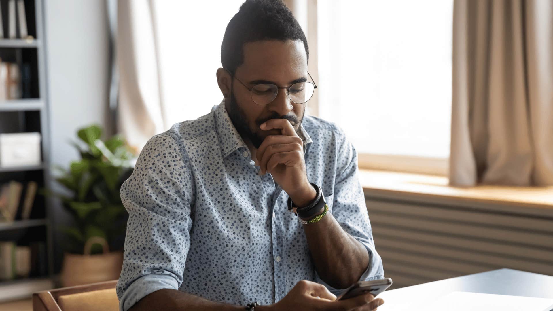 man waiting patiently by the phone