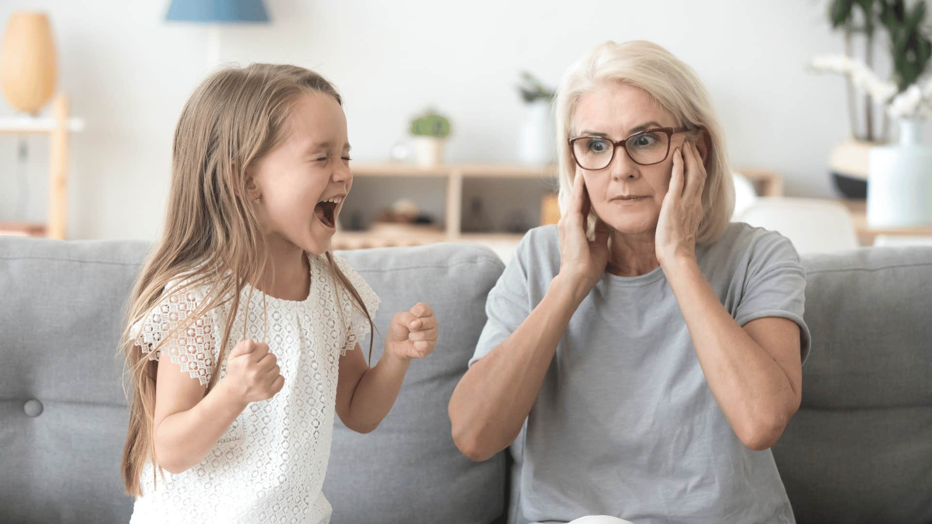 stressed grandmother babysitting child