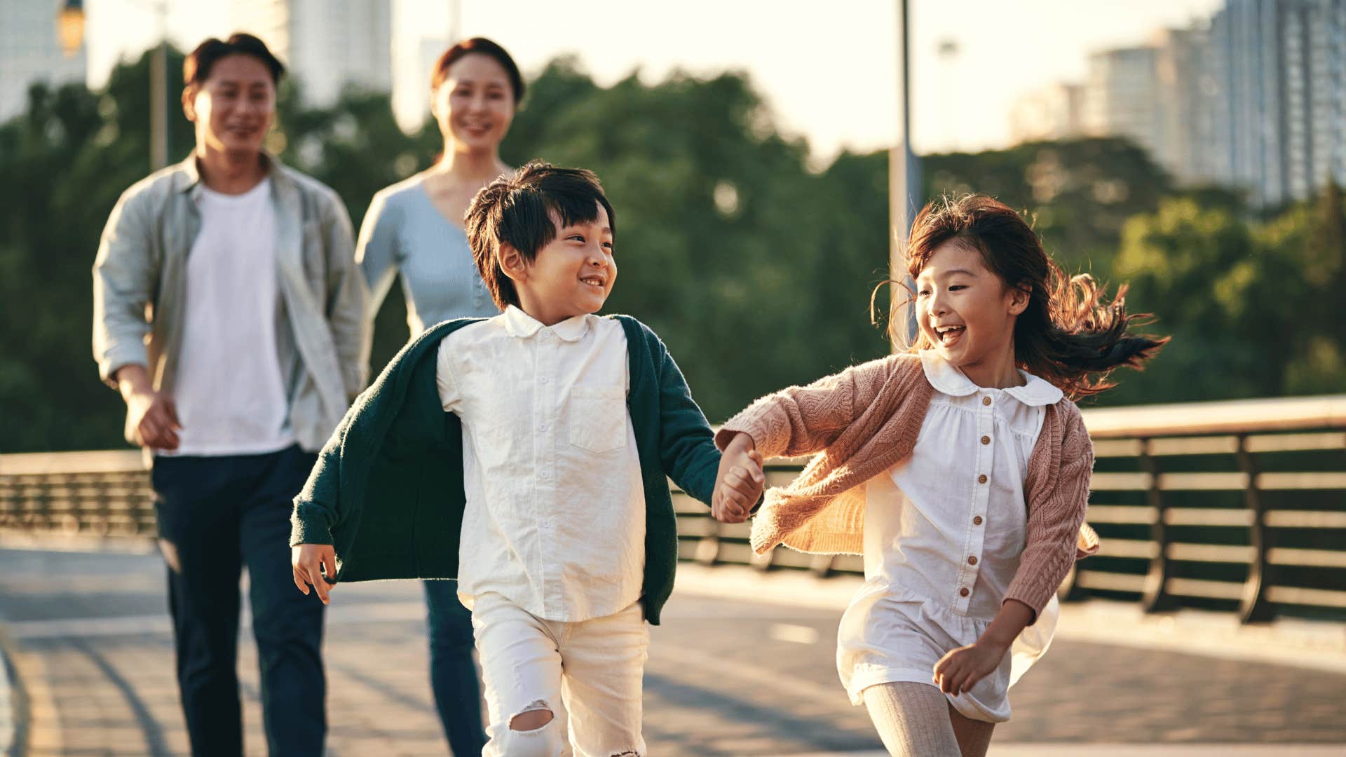 family watching two children play