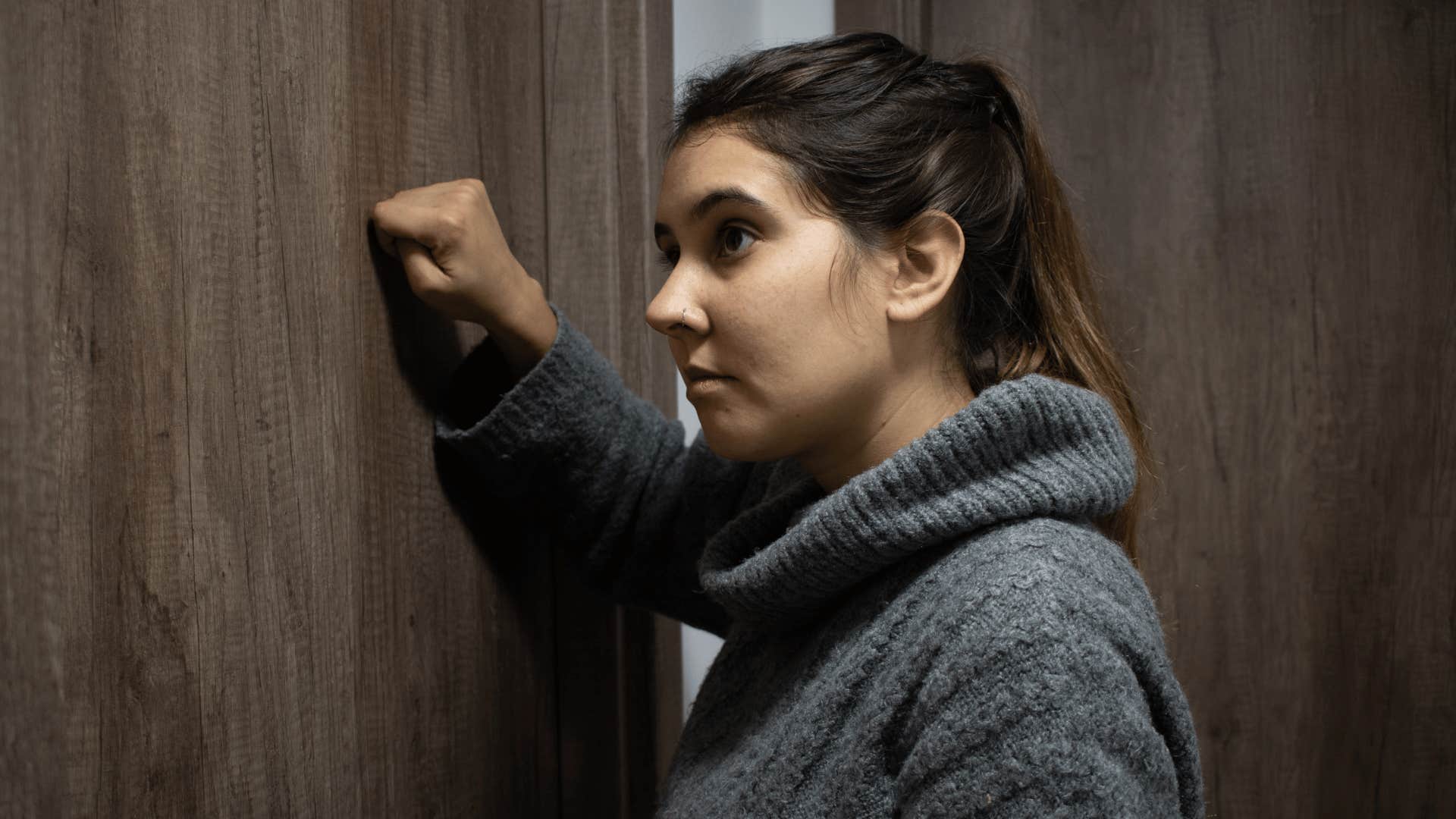 woman knocking on a door