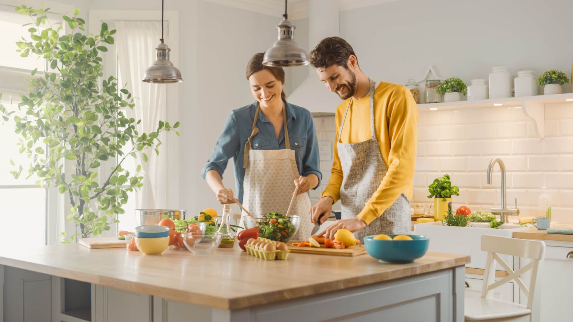 couple cooking in kitchen