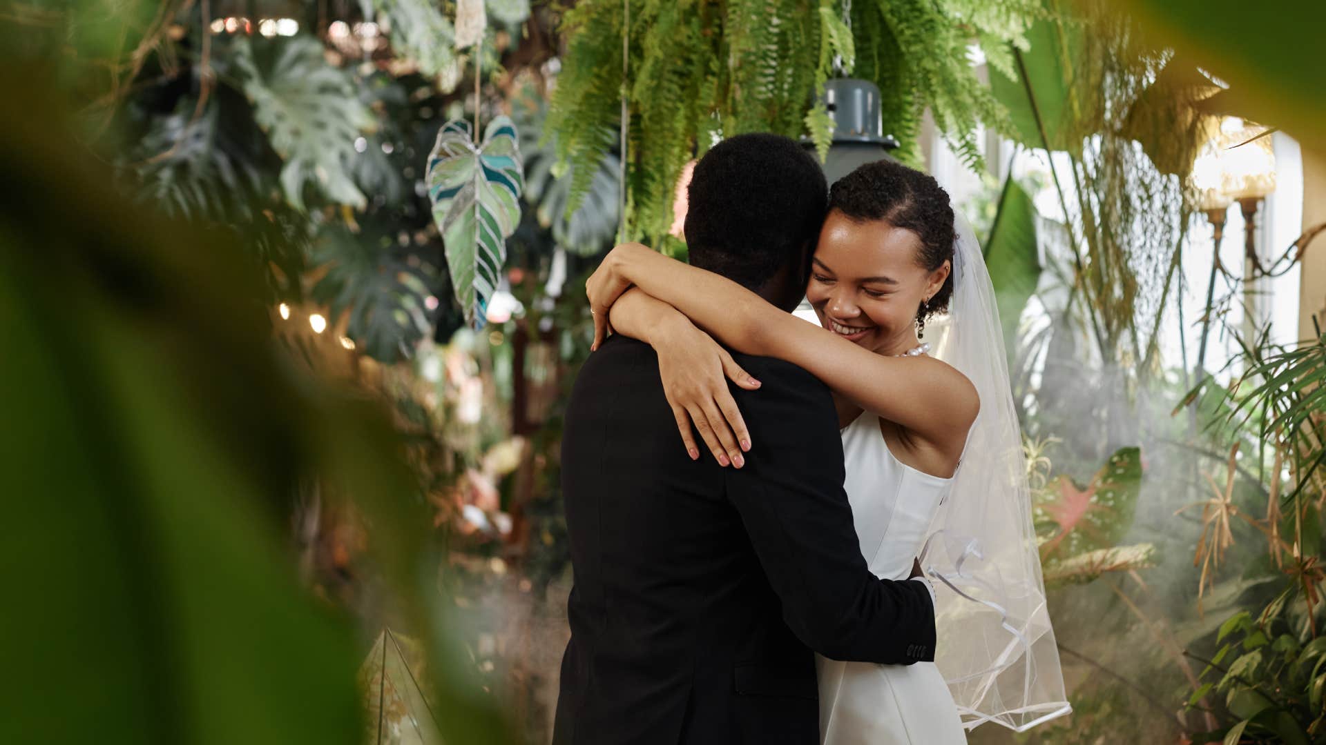 bride and groom hugging