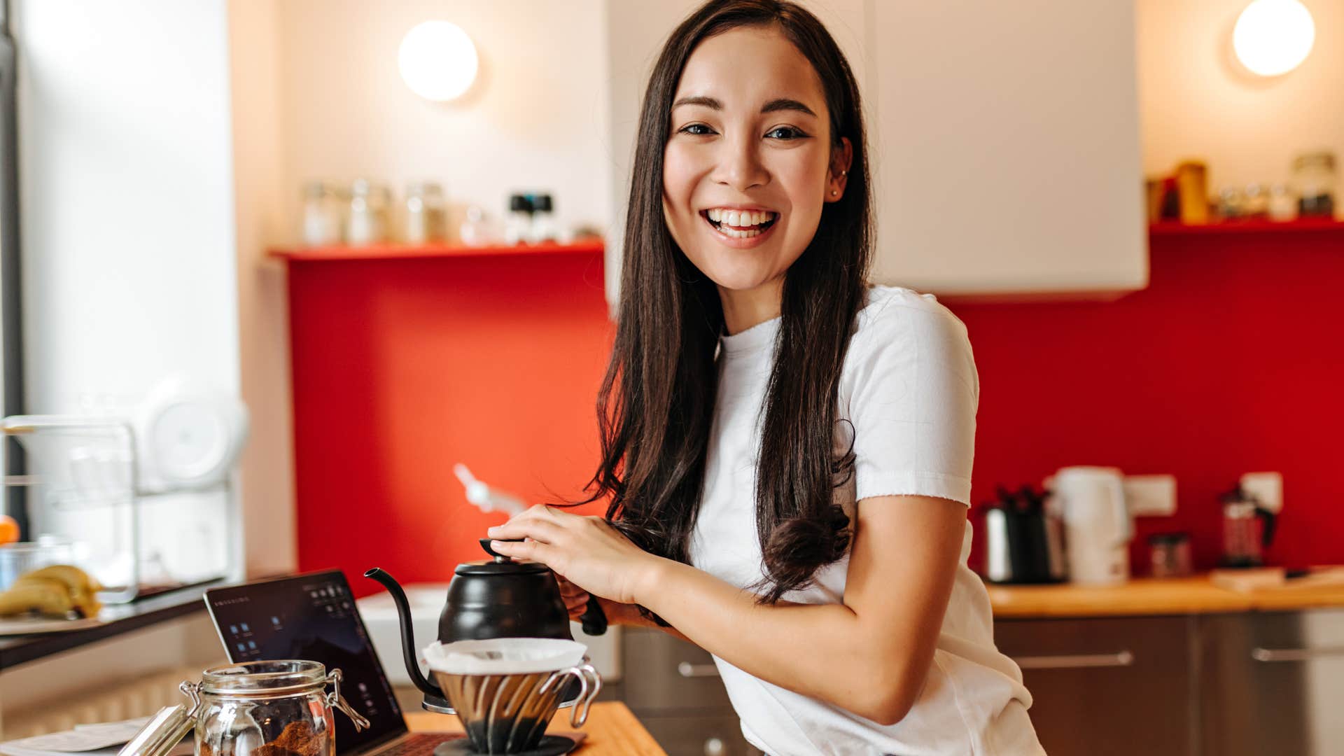 woman making coffee in her kitchen