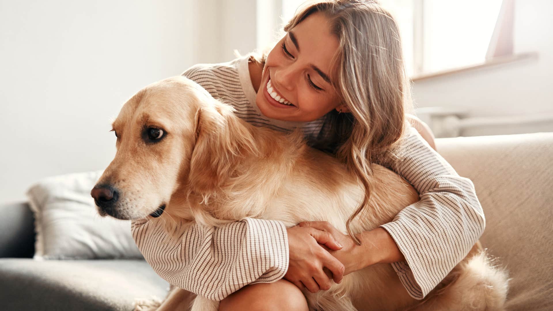 woman hugging her dog