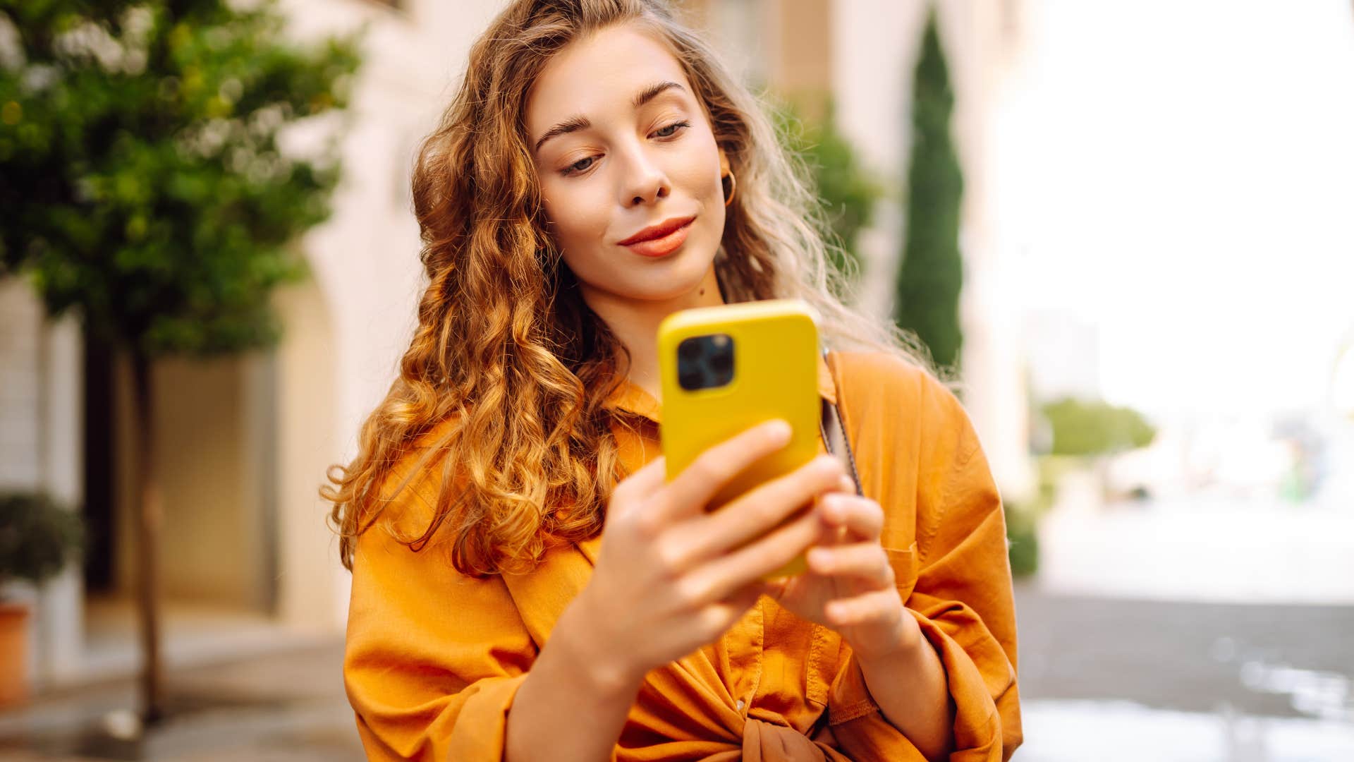 woman scrolling on her phone