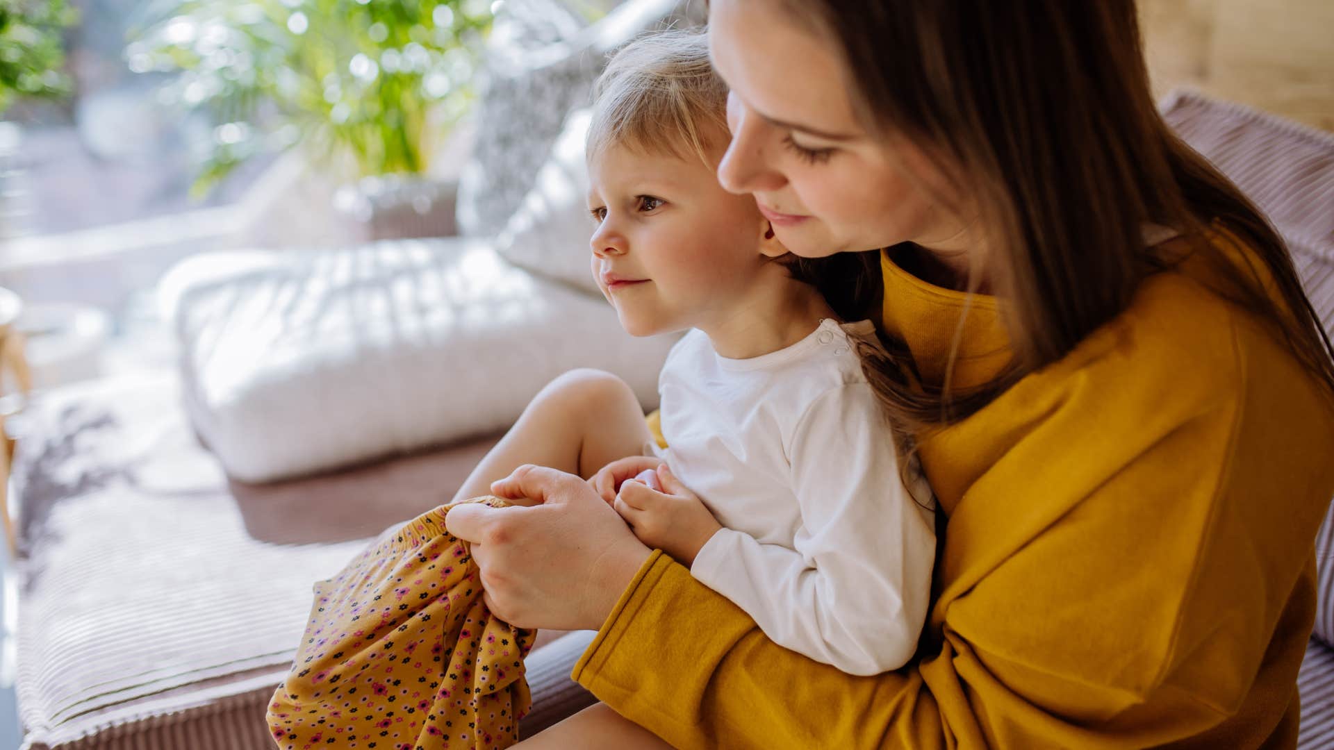 woman sitting with toddler in her lap