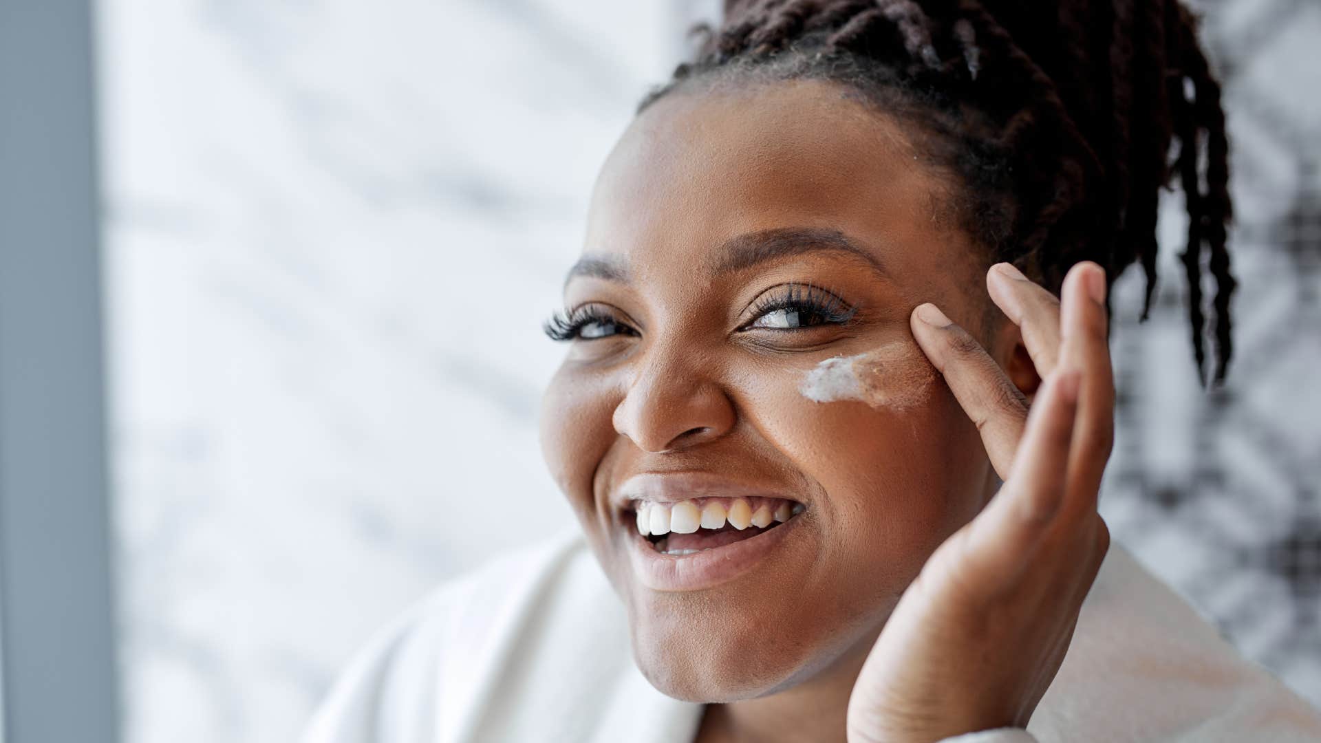 woman using high-end skincare products