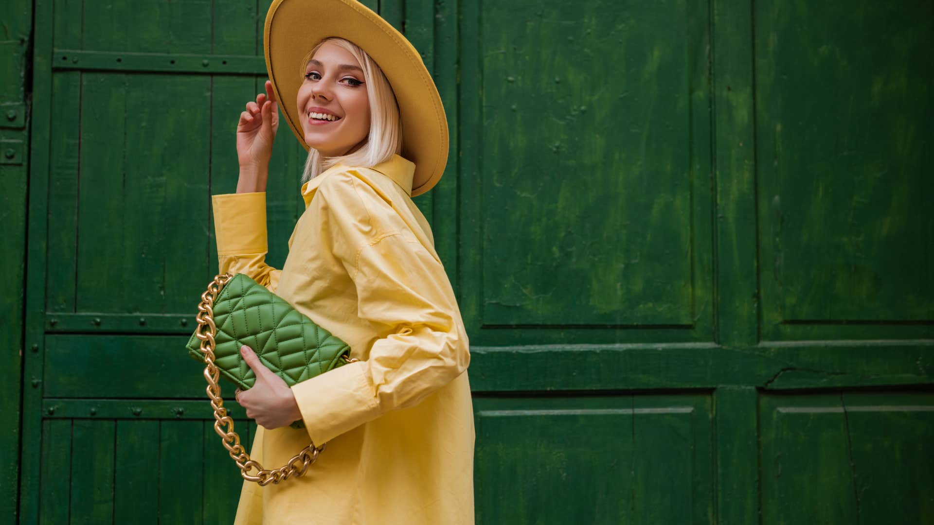 woman posing with luxury handbag