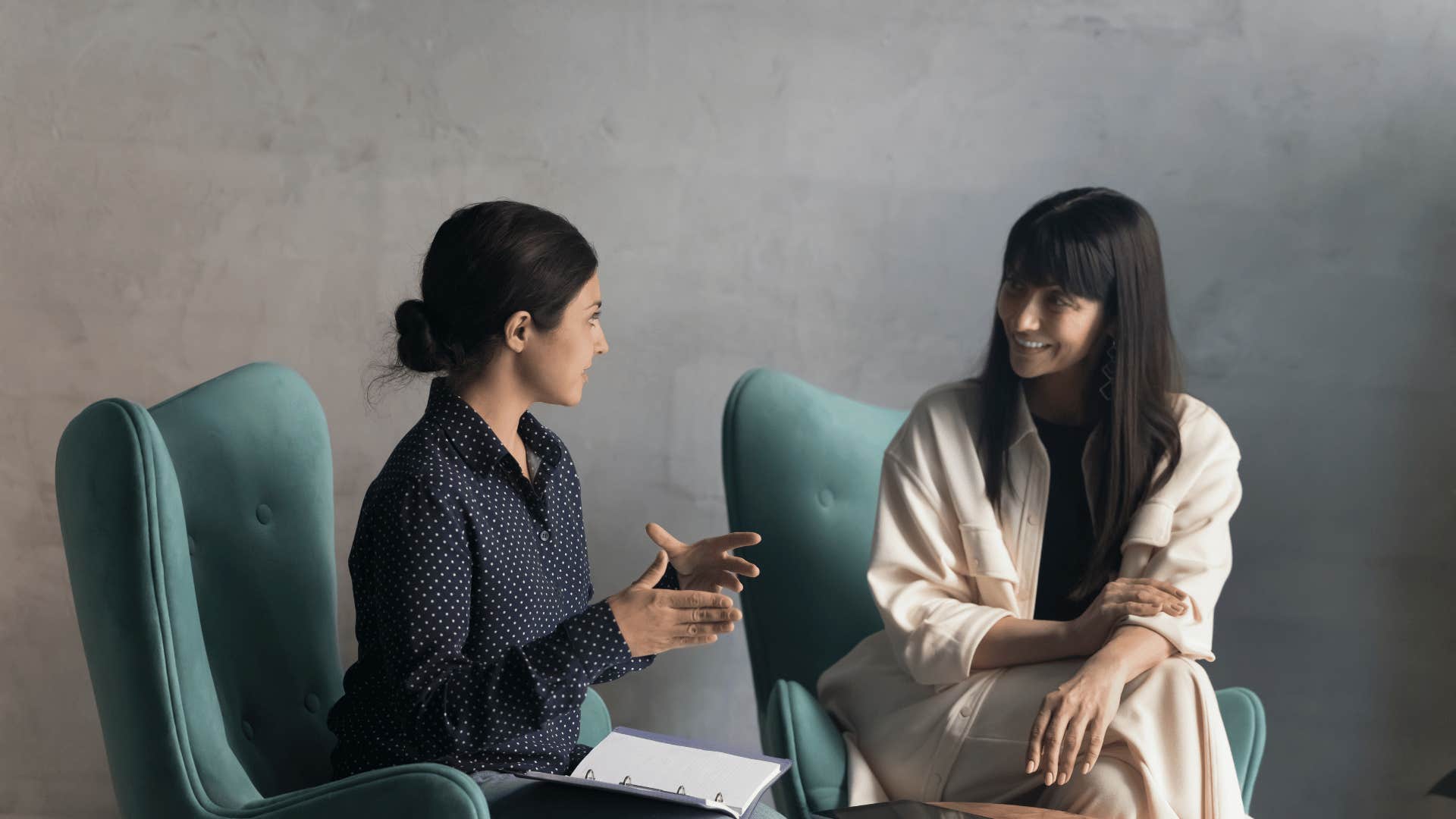 woman asking other woman questions