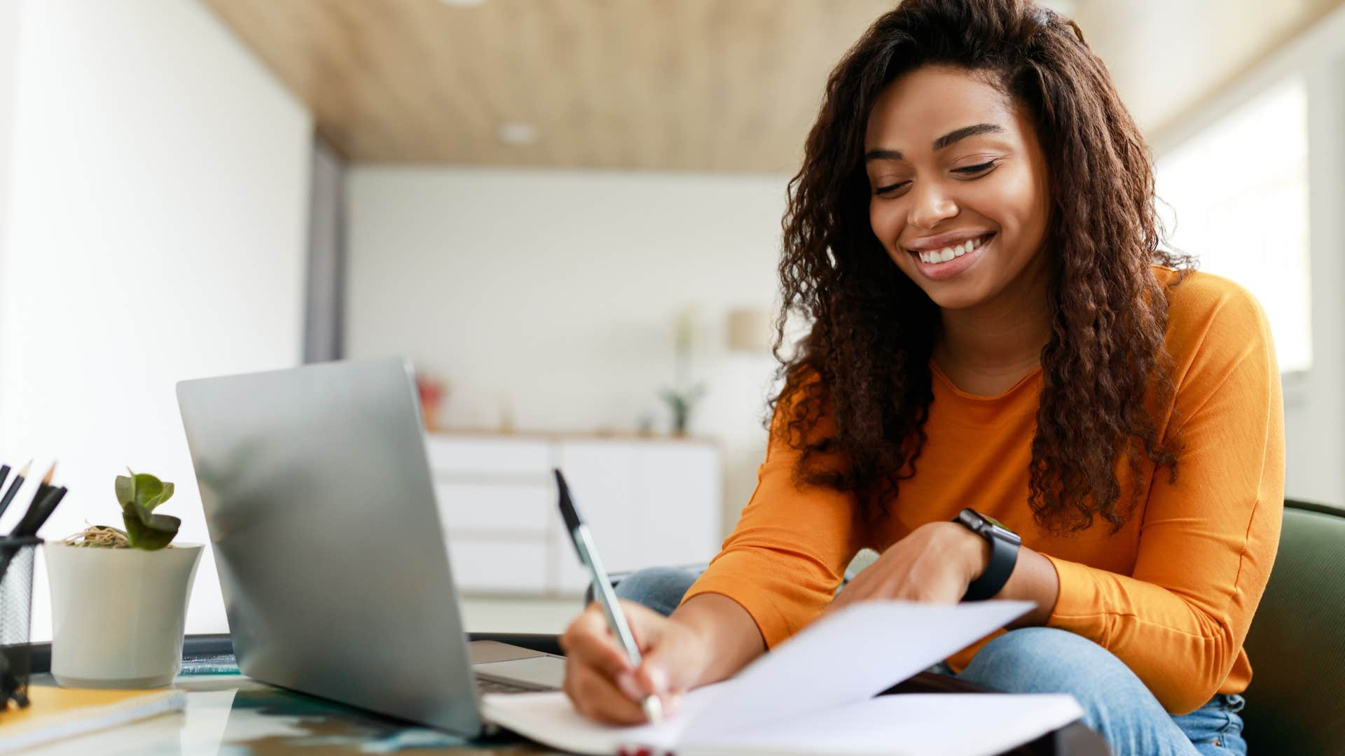 Young woman writing for her professional growth