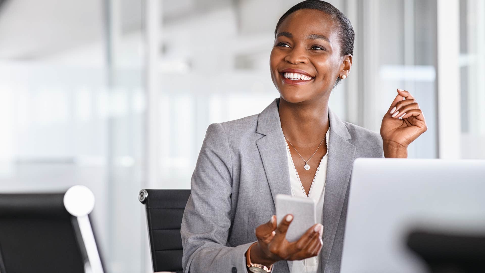 Happy professional woman focused on her well-being at work