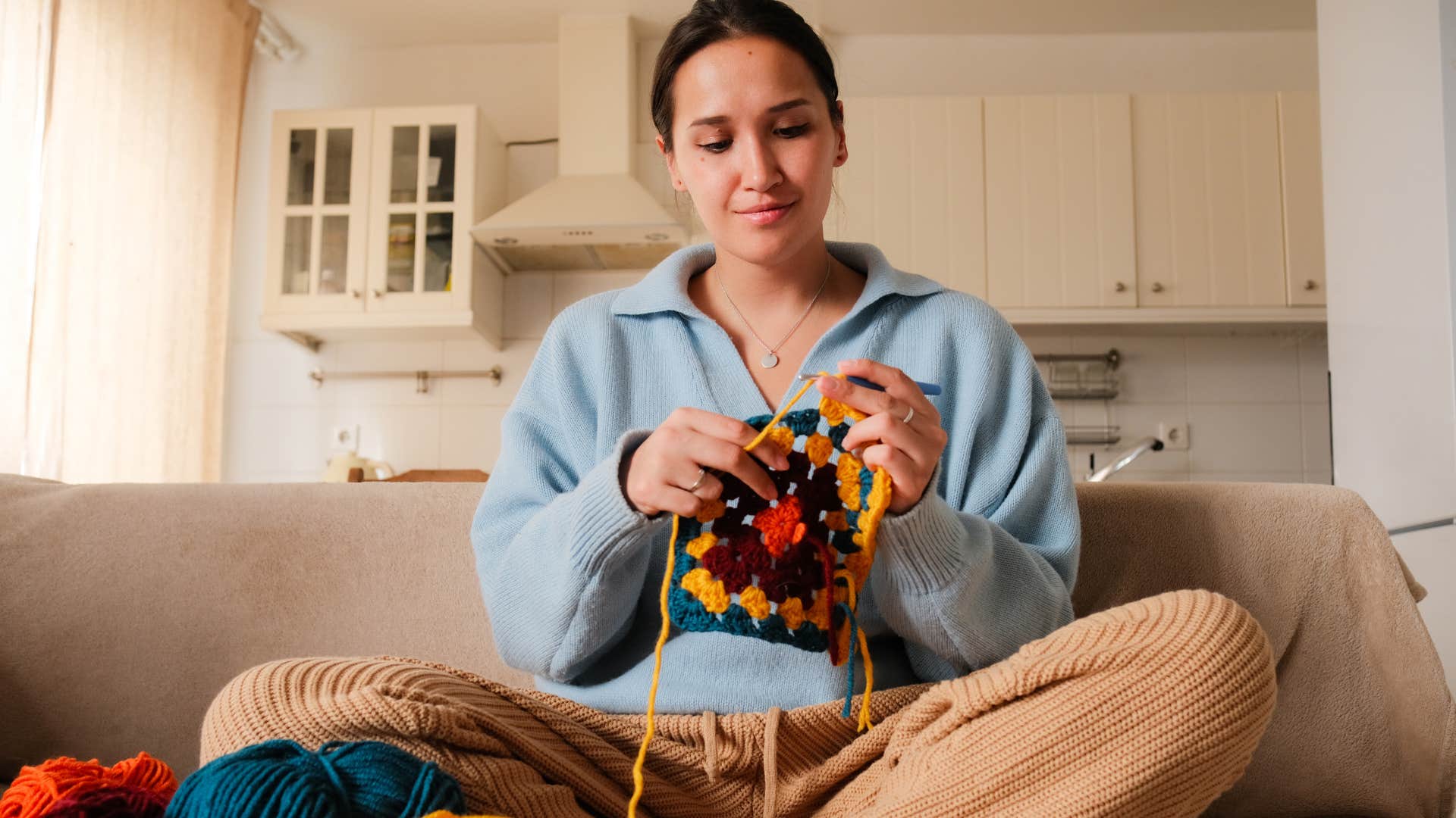 Gen Z woman taking up a knitting hobby