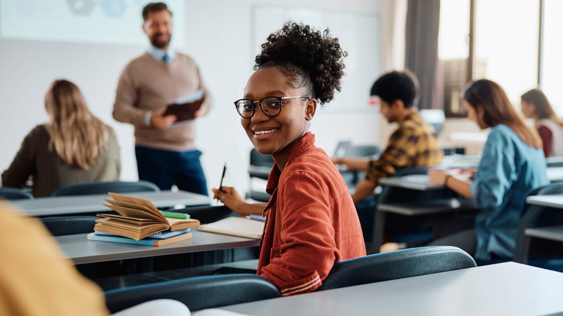 millennial woman who values education sitting in class