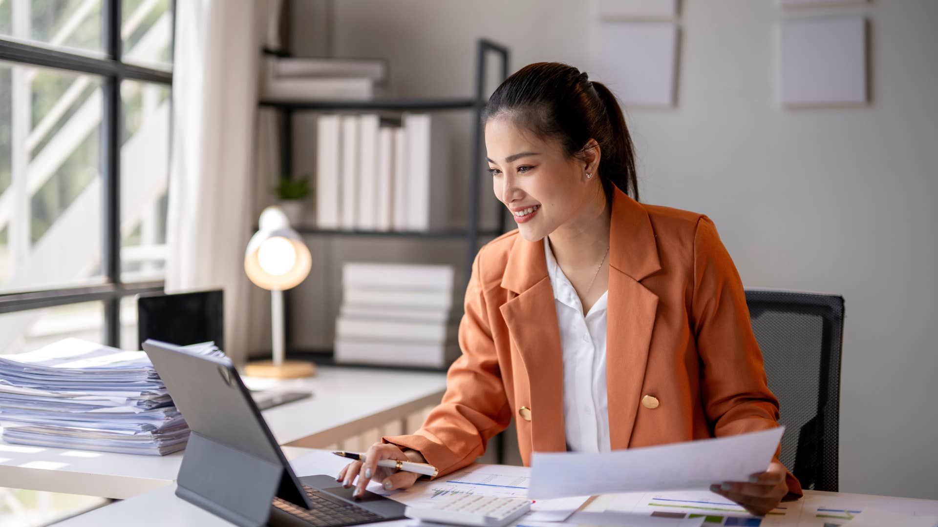 millennial woman happily working