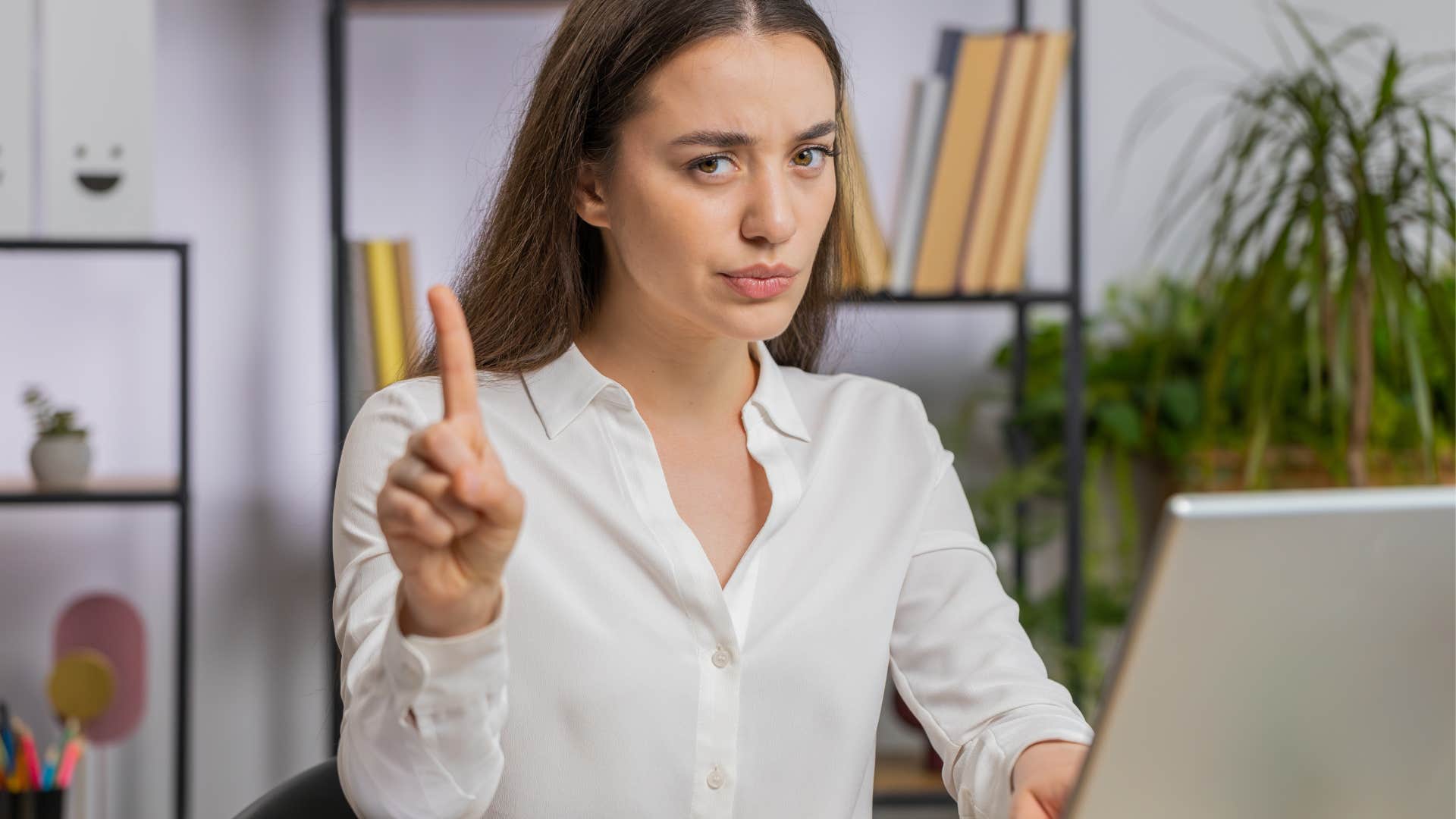 woman waves her finger to signal she doesn’t tolerate bad behavior