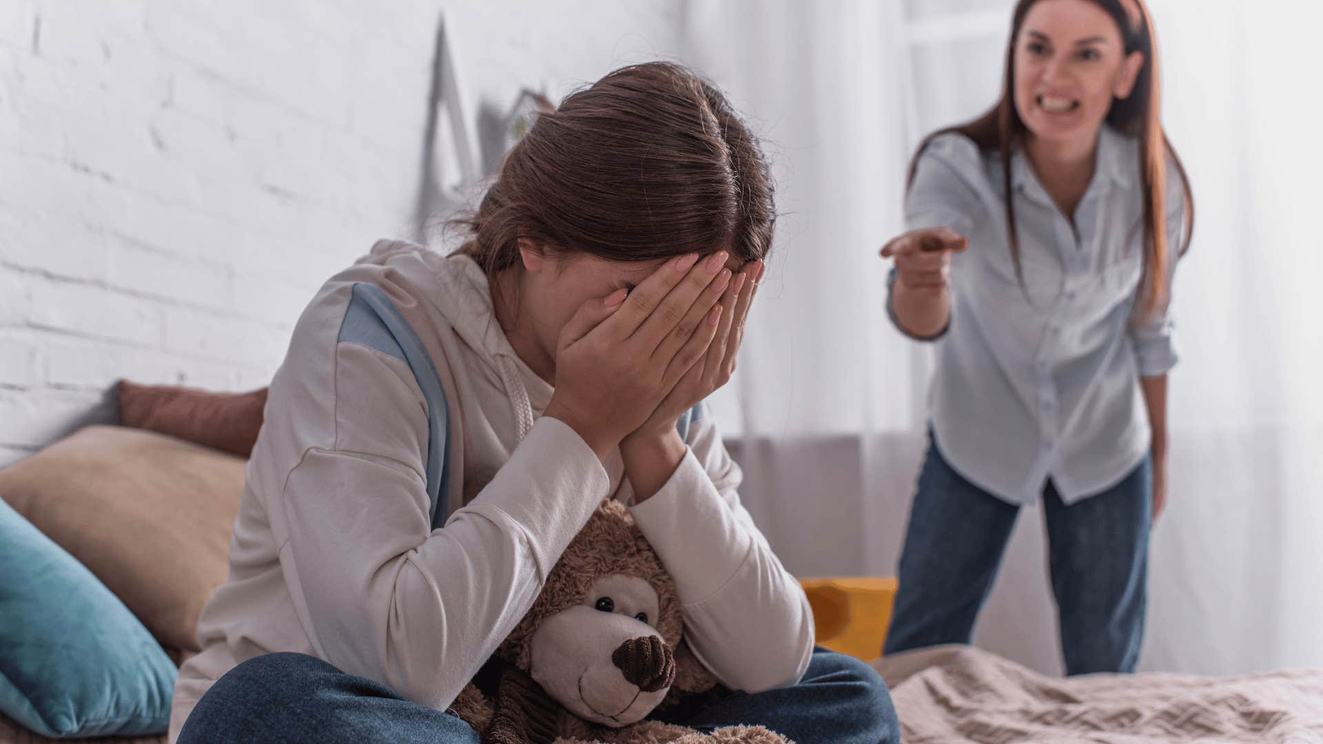 mother yelling at crying daughter