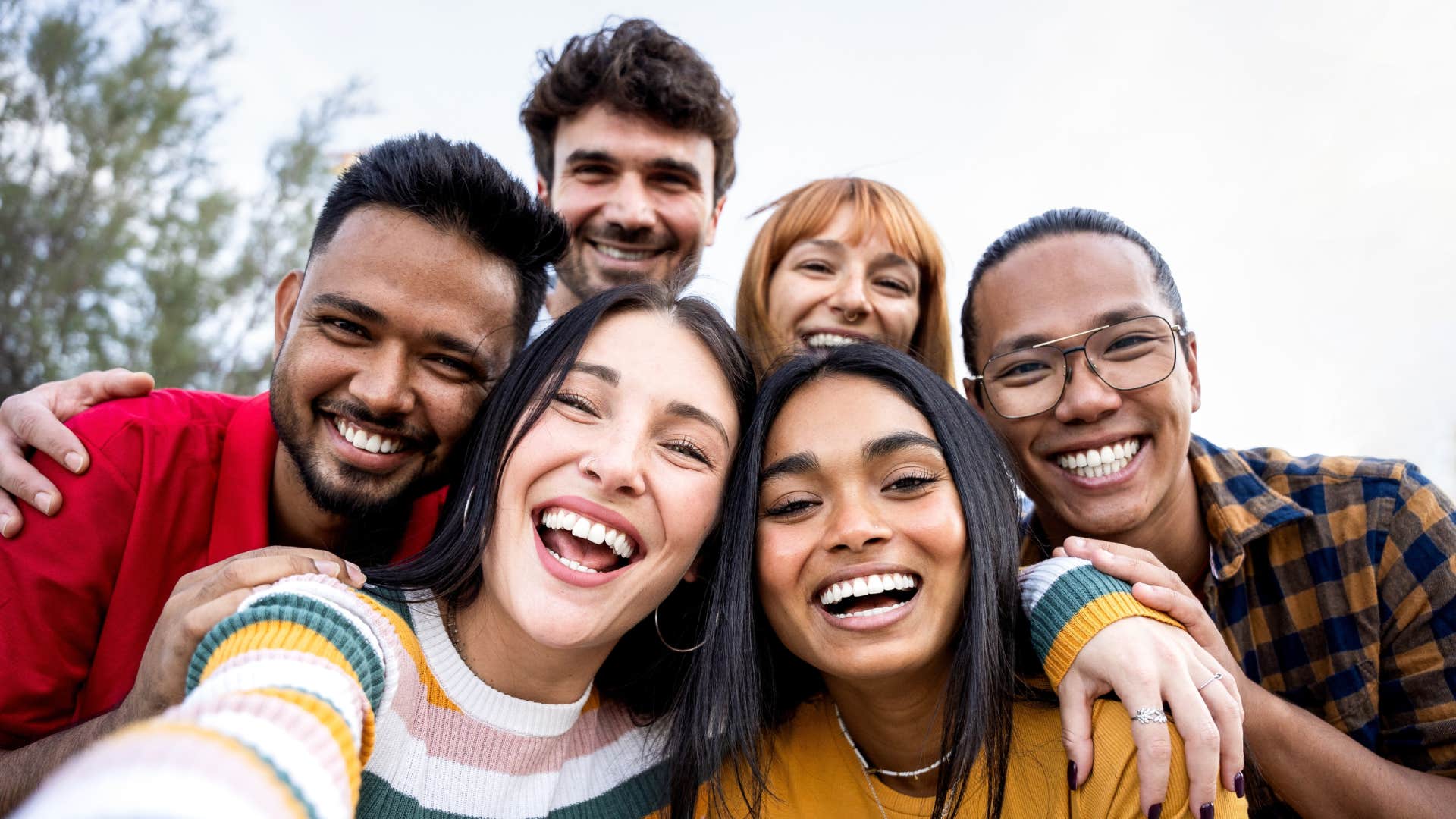 group of diverse gen z friends smiling championing diversity and inclusion