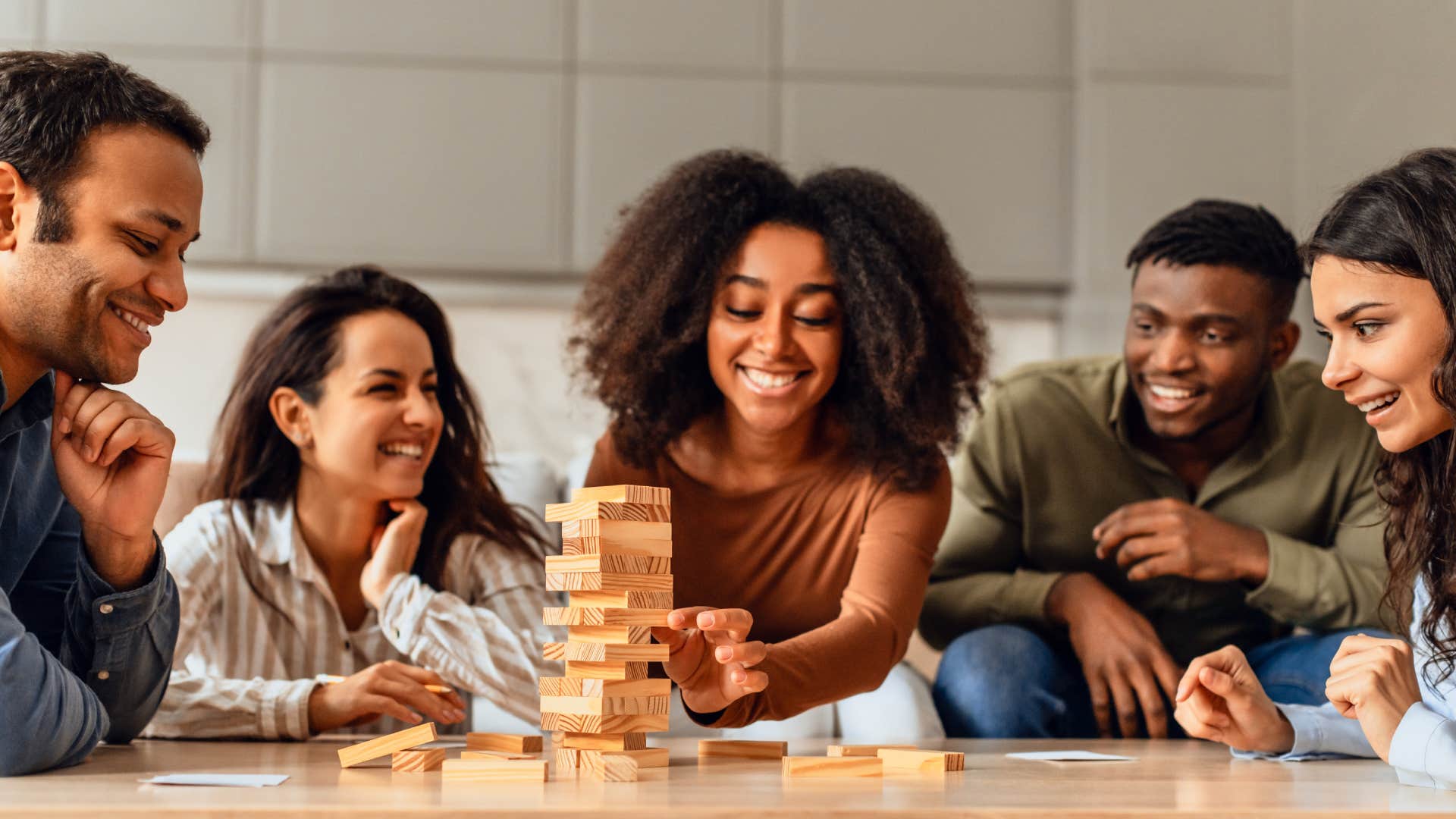 gen z friends playing jenga reinventing the value of friendship