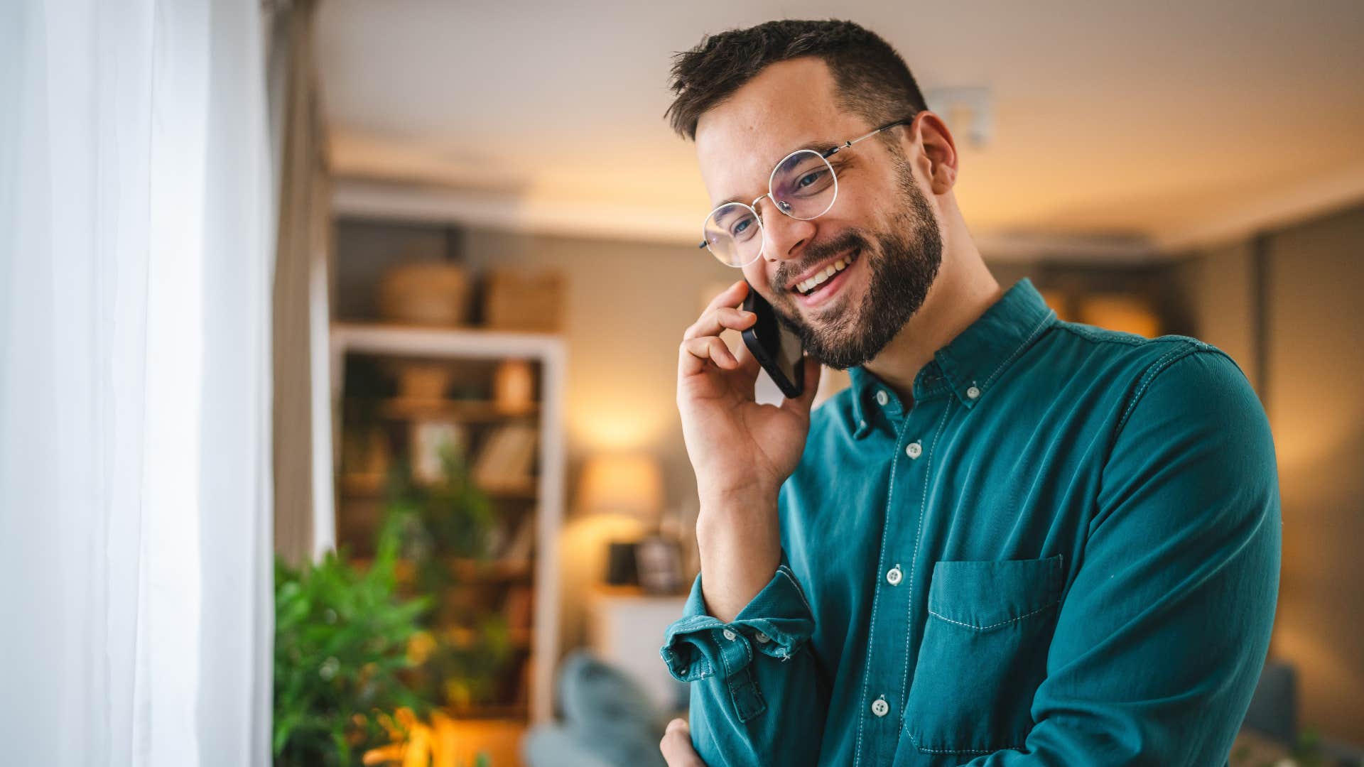 man politely ending a phone call by saying is there anything else I can help you with