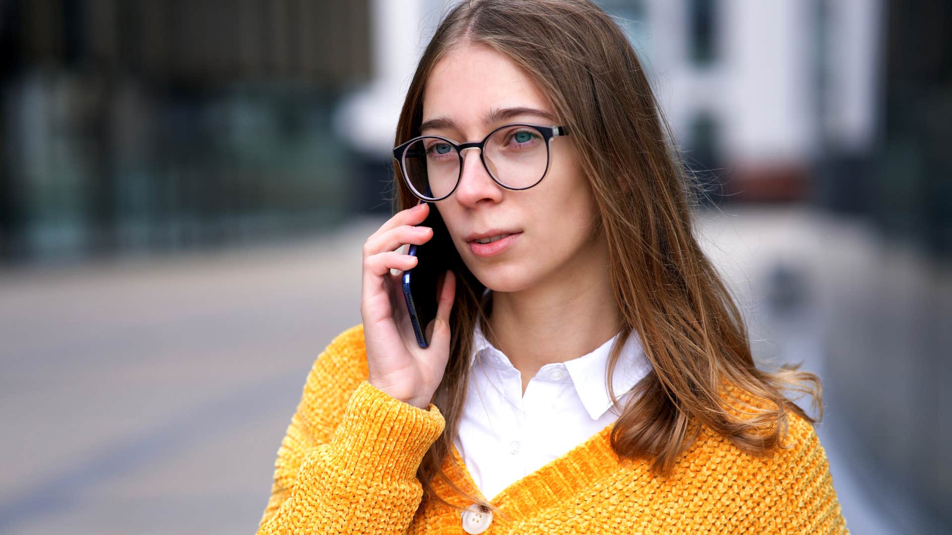 woman politely ending a phone call by saying it was great catching up with you