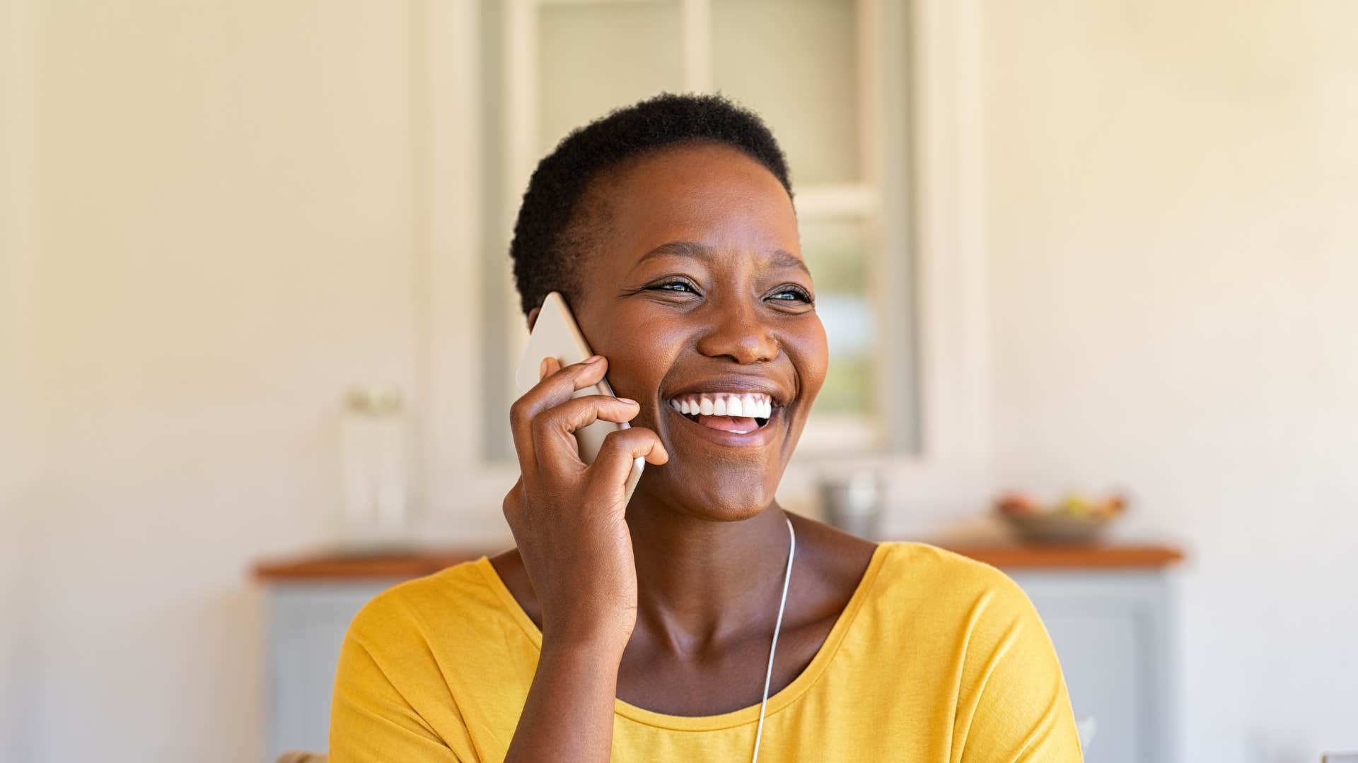 woman politely ending a phone call by saying I have to go, but I will do