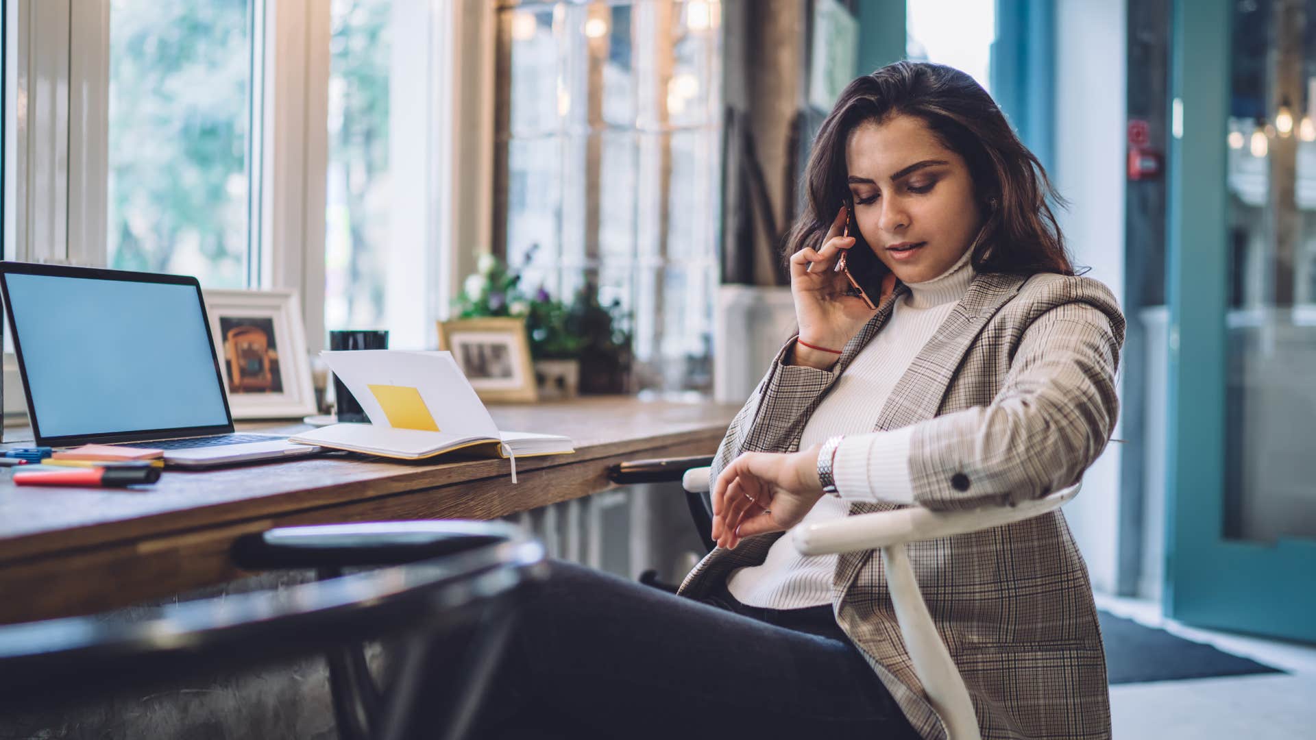 woman politely ending a phone call by saying let’s talk again soon