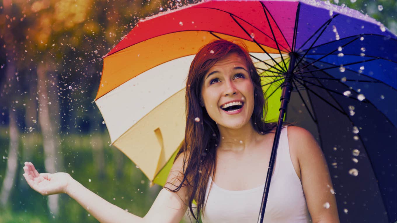 happy woman discovering spiritual meaning rain birthday