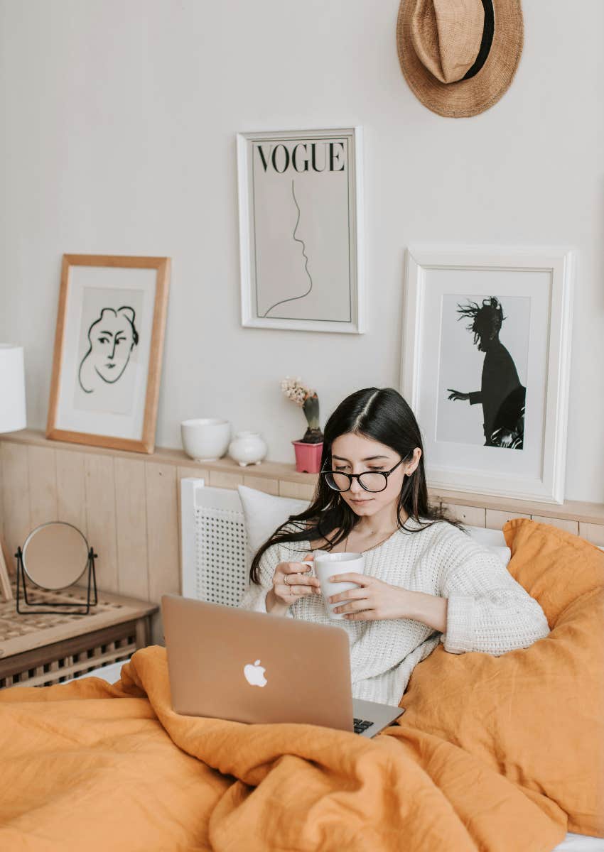 financially successful woman tracking her expenses on computer