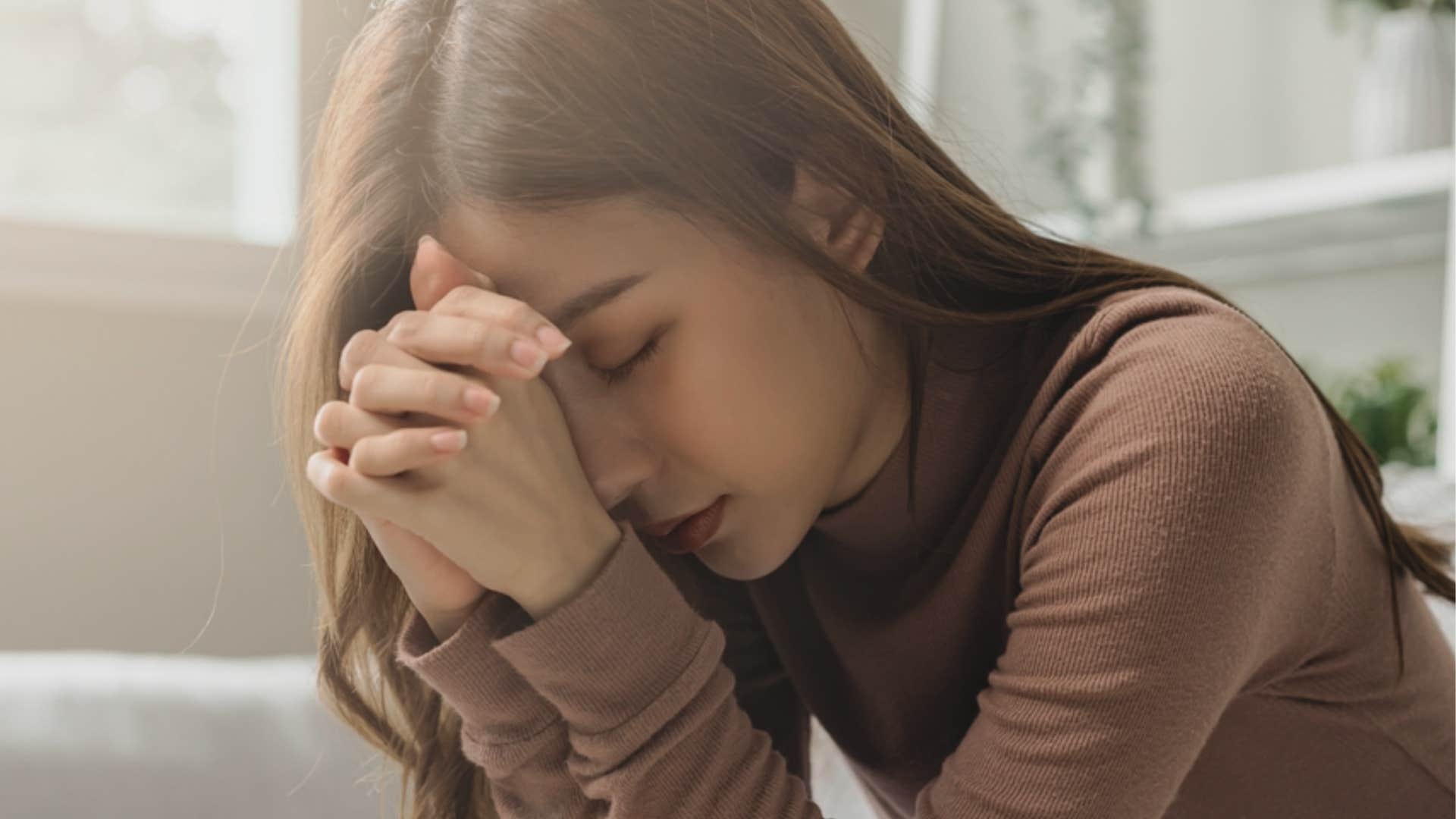 woman feeling unexplained dread in her home 