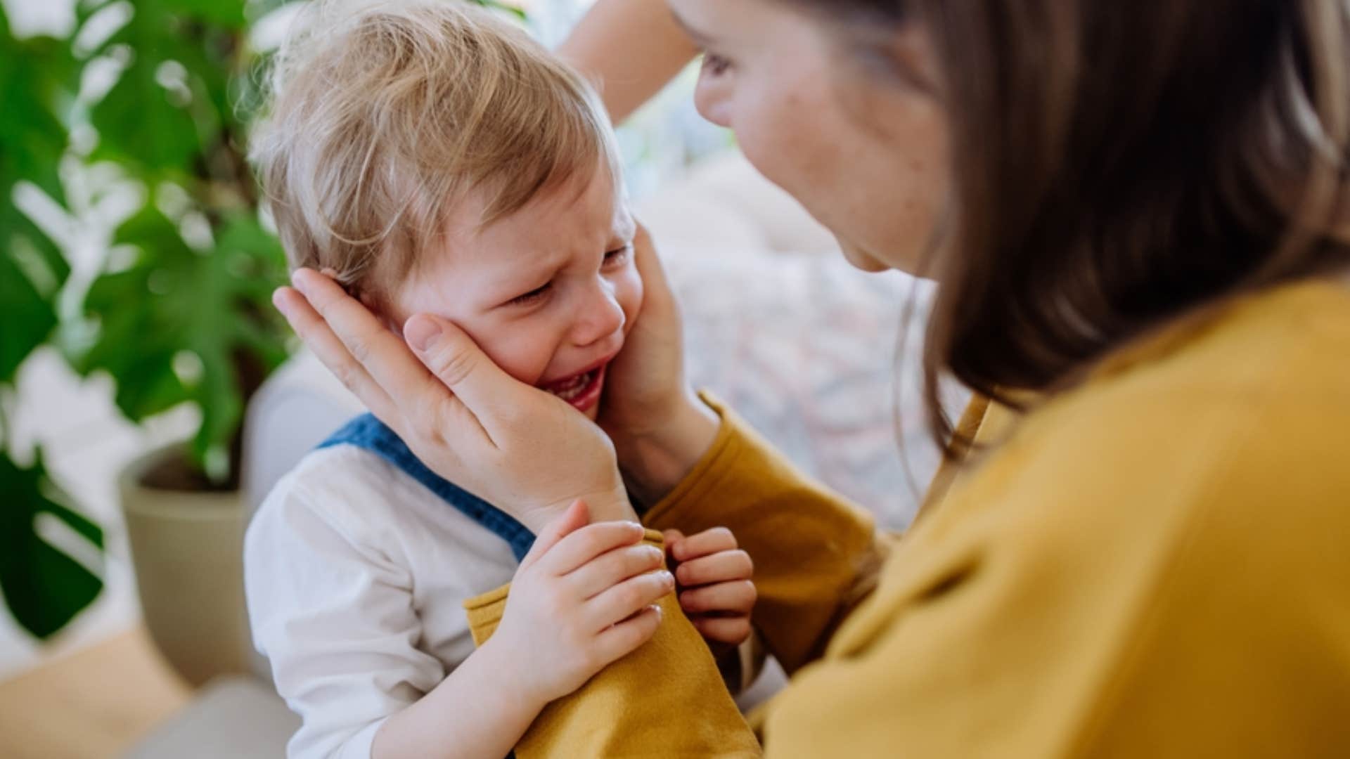 mom telling son boys don't cry 