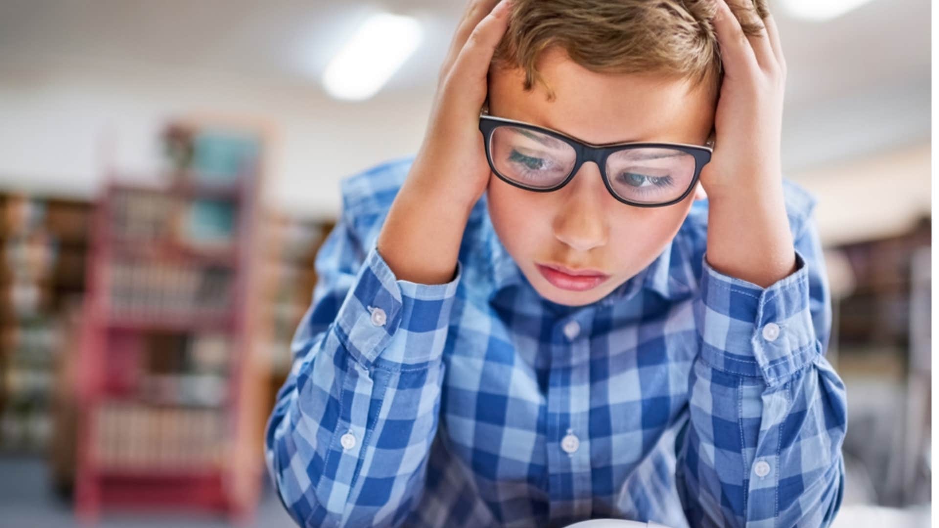 little boy studying for test so he doesn't fail and get grounded 