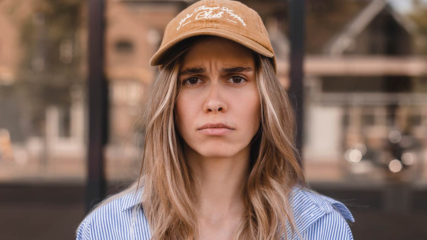 Insufferable Phrases Used By People Who Refuse To Take Responsibility For Their Own Actions insufferable woman shrugging off responsibilities looking angry