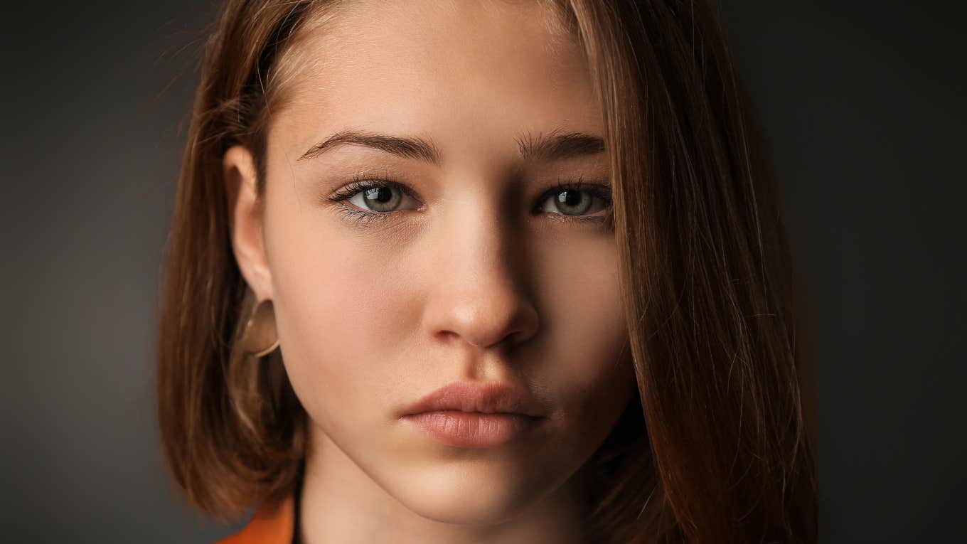 Sad Signs You’re Emotionally Invested in Someone Who’s Not Invested In You, According To Psychology Woman realizes someone is not invested in her.