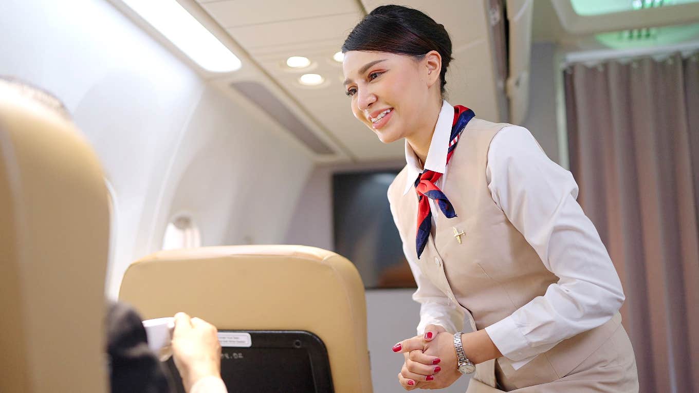 Passenger Hands Flight Attendant List Of Allergy Demands Flight attendant handed a list of allergy demands