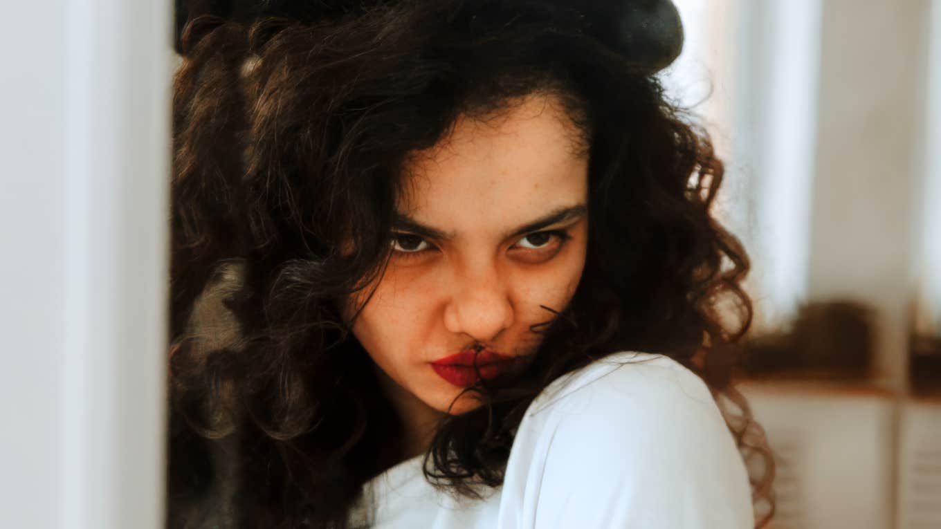 TK Psychologist-Approved Ways To Manage Anger Without Hurting The Person You Love Woman trying to manage anger without hurting the person she loves.