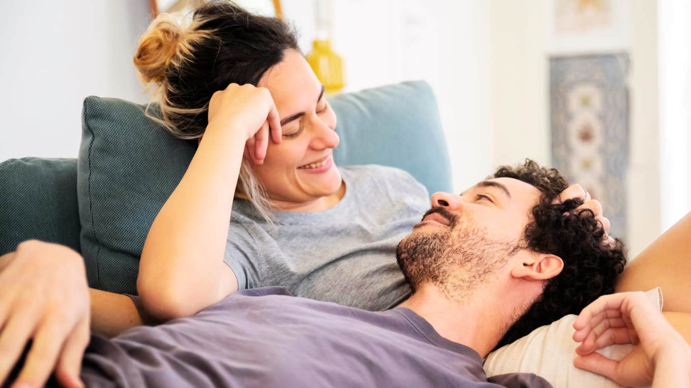 We Pulled the Best Relationship Advice From Dozens of Books — These Tips Actually Work Couple embracing the best relationship advice from dozens of books.